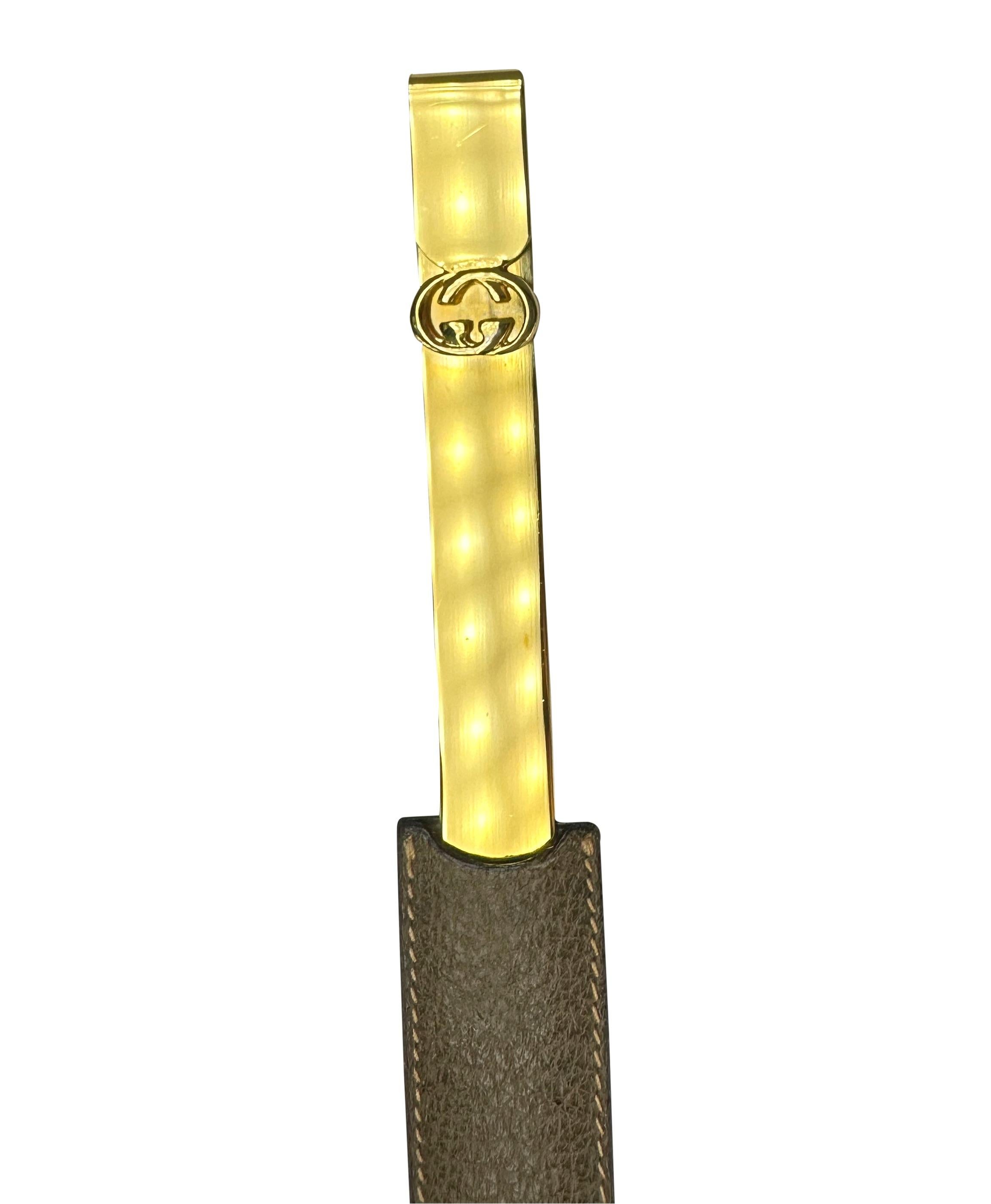 TheRealList presents: a fabulous gold tone 'GG' Gucci letter opener/bookmark. From the 1970s, this elegant Gucci letter opener and bookmark is constructed in gold-tone metal and features a 'GG' logo at the top. This beautiful vintage piece is made
