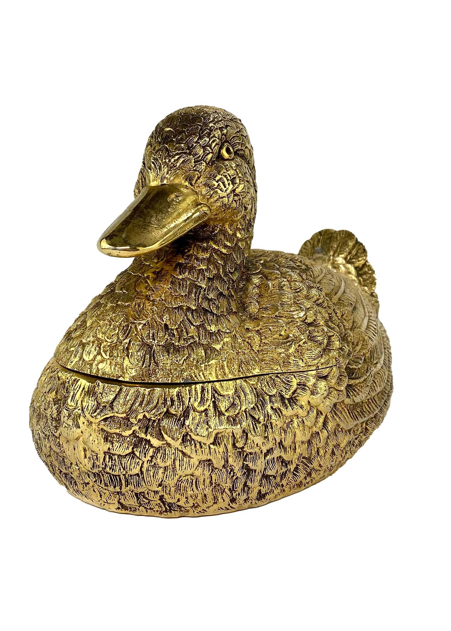 TheRealList presents: a large golden Gucci mallard duck container from the 1970s. The metal model, similar to the size of a small duck, takes the country and equestrian influences of early Gucci and elevates them making them chic and shiny. This