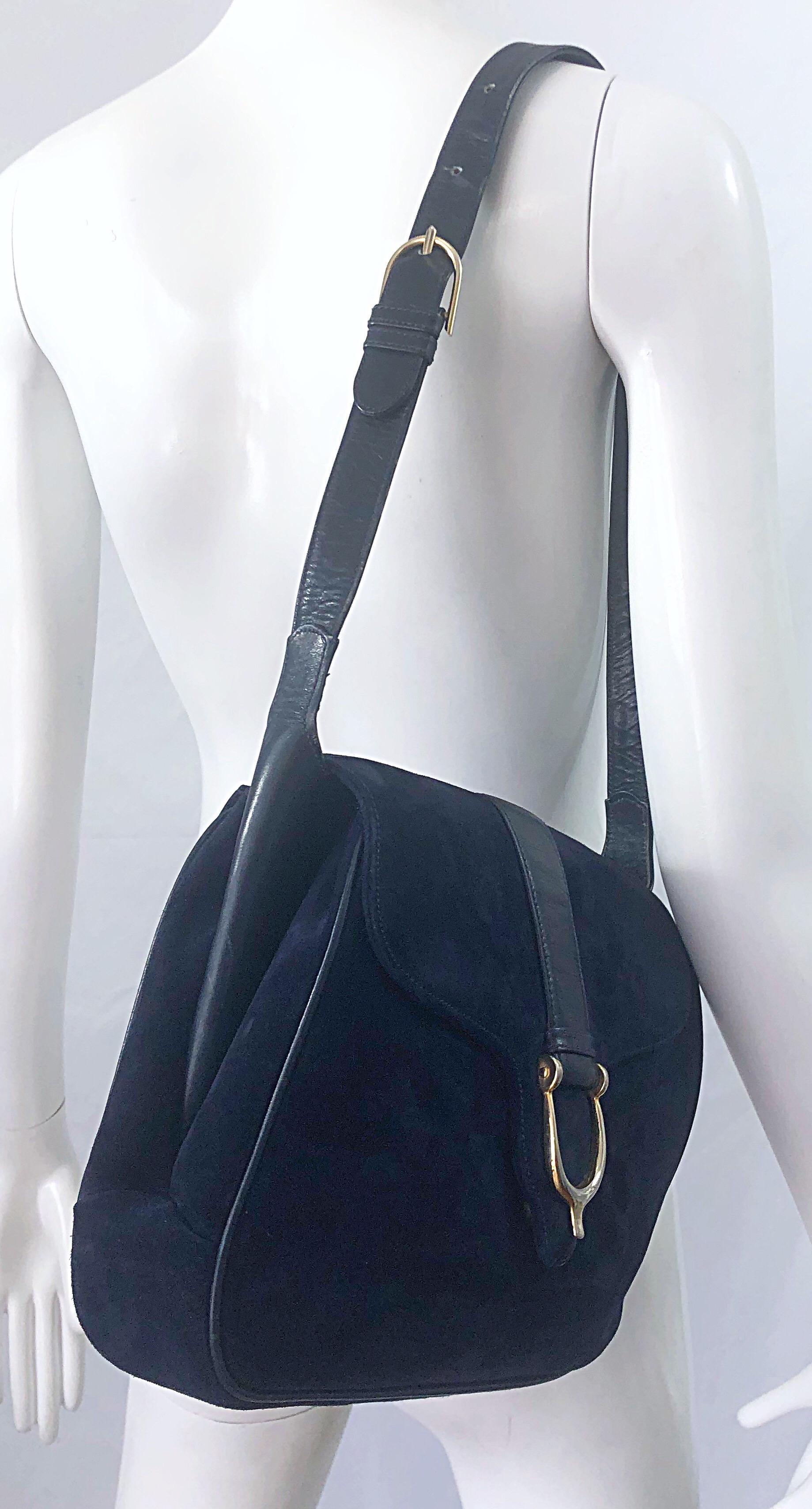 Insanely chic and classic large 1970s GUCCI navy blue suede and leather shoulder bag ! Features the prettiest navy blue suede with leather accents. 'Wings' on each side of the bag can be pulled out to make the bag even larger ( see photos ). Snap