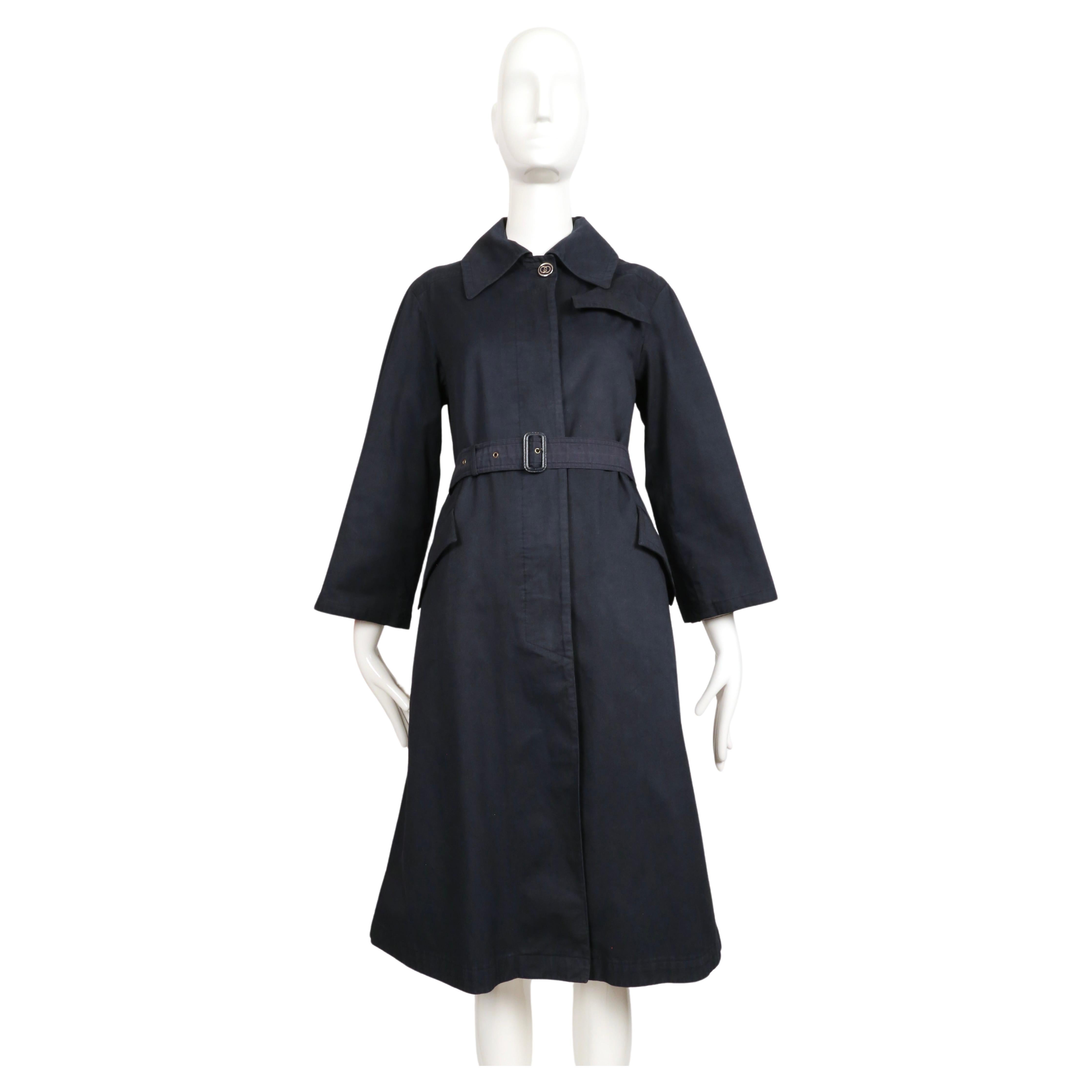 Very rare, navy blue trench coat with enameled GG buttons designed by Gucci dating to the 1970's. Labeled an Italian 42, however this best fits a US 2-6. Approximate measurements: shoulder 16