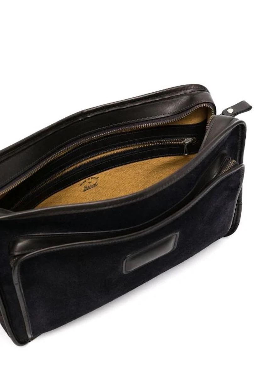 Gucci navy suede shoulder bag featuring  leather trim, detachable shoulder strap, front zip-fastening compartment, internal zip-fastening pocket, internal logo stamp, full lining, silver-tone hardware, rectangle body.
In good vintage condition. 
