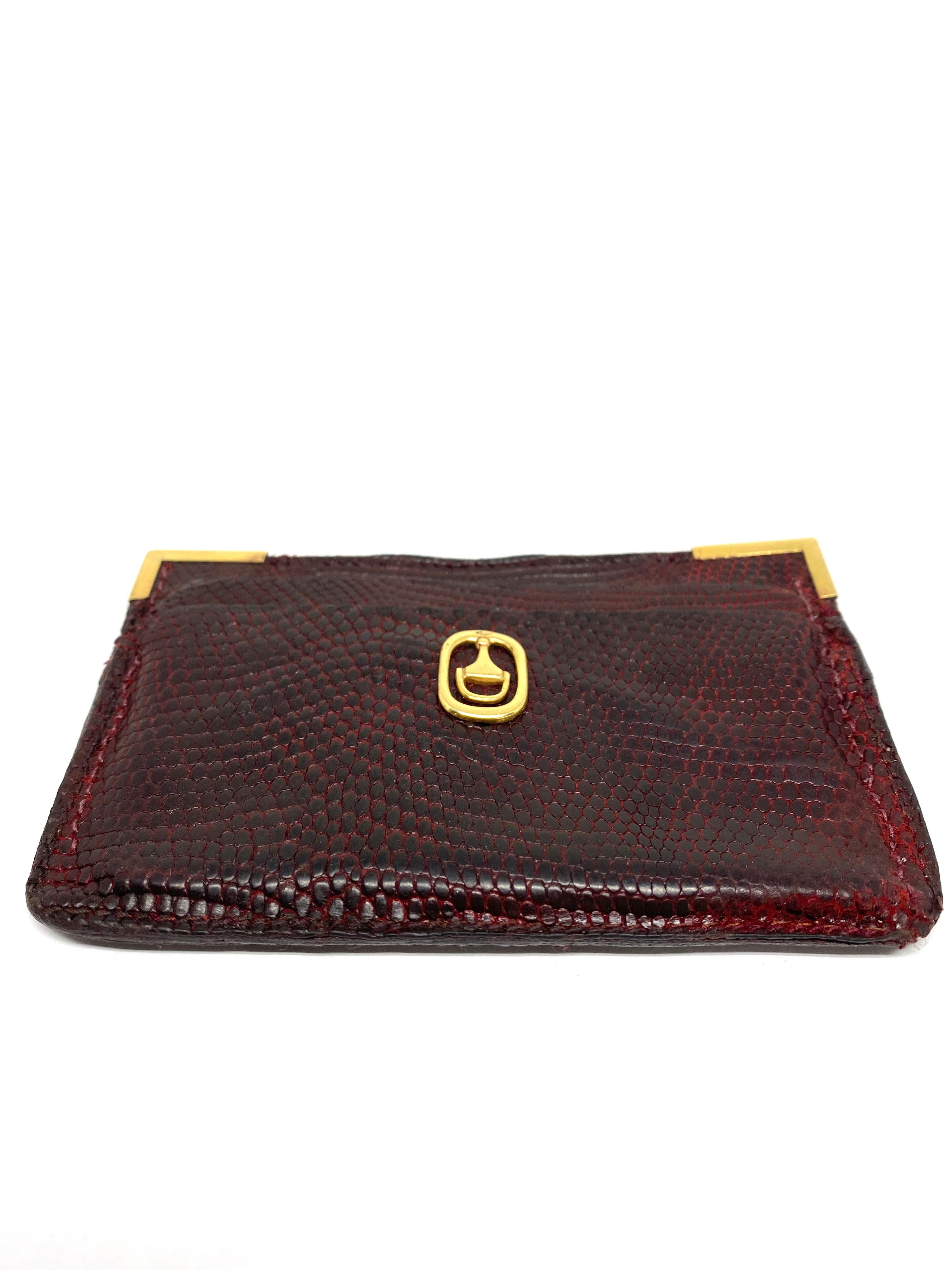 
1970s GUCCI Red Animal Skin and 18K Yellow Gold Card Holder Wallet

Product details:
Red/ burgundy animal skin card holder wallet 
Fits four cards, two on each side 
All the hardware is 18K yellow gold
Featuring 18k yellow gold vintage Gucci logo