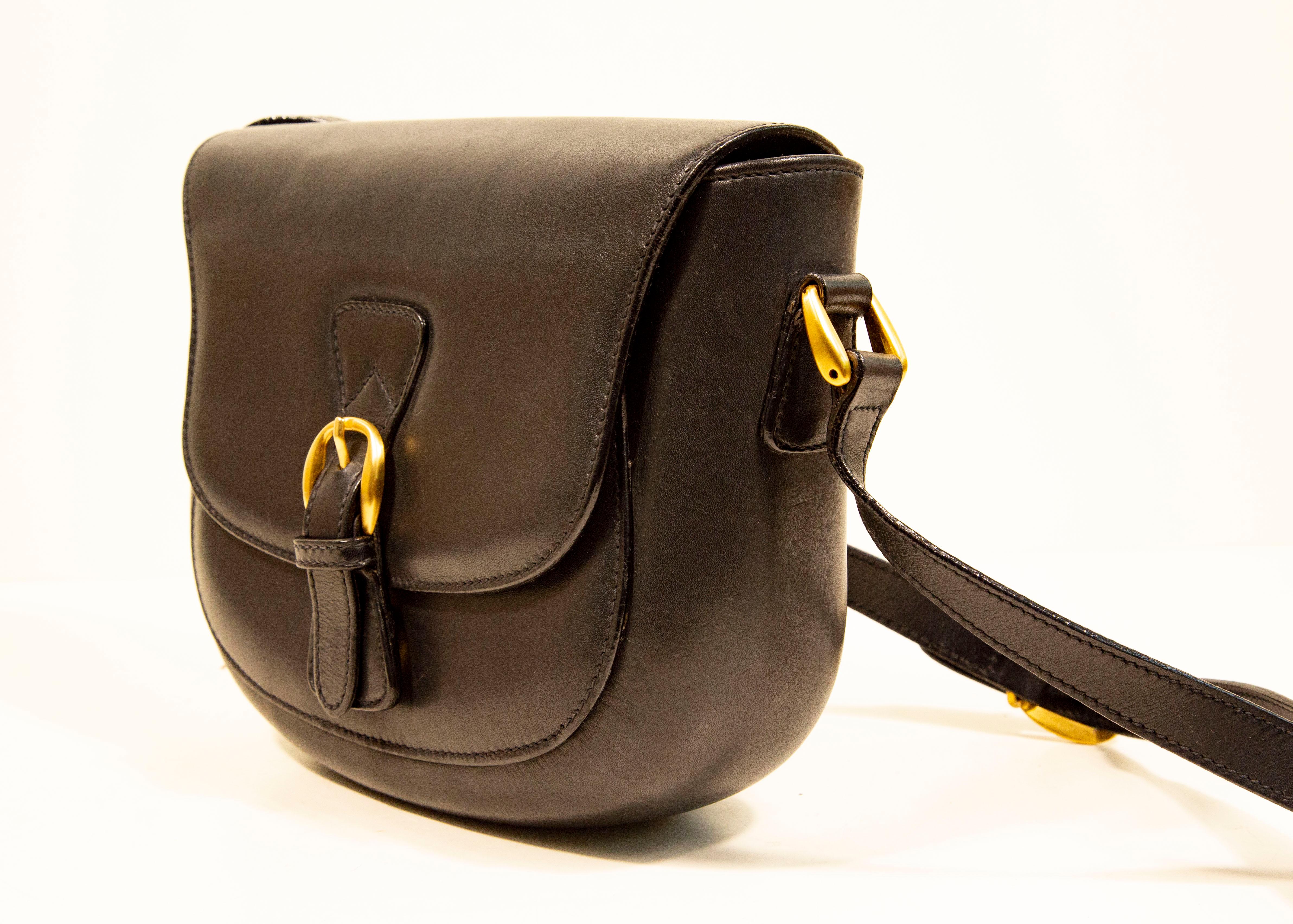 Women's or Men's 1970s Gucci Saddle Bag Crossbody Bag in Black Leather with Gold Toned Hardware