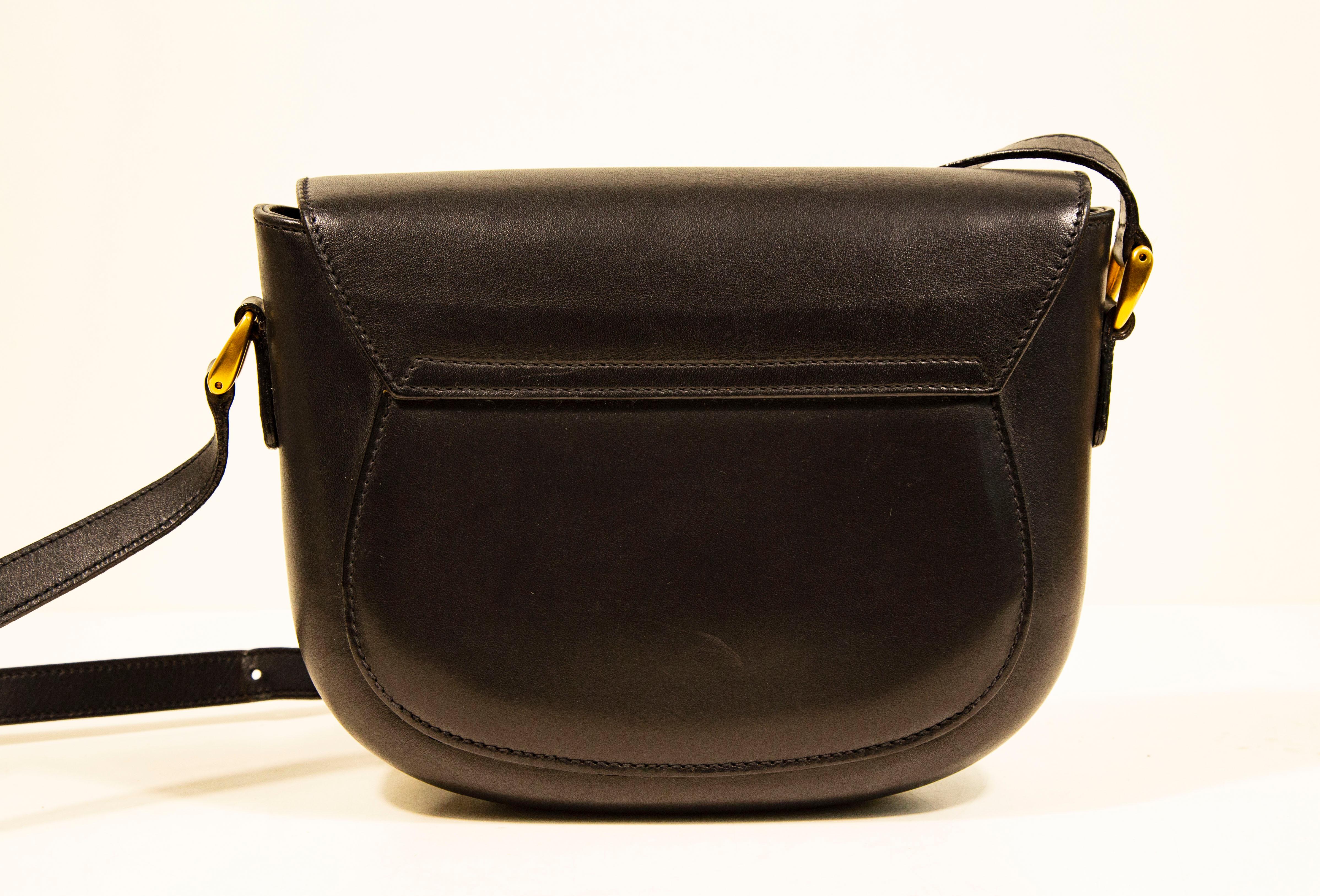 1970s Gucci Saddle Bag Crossbody Bag in Black Leather with Gold Toned Hardware 1