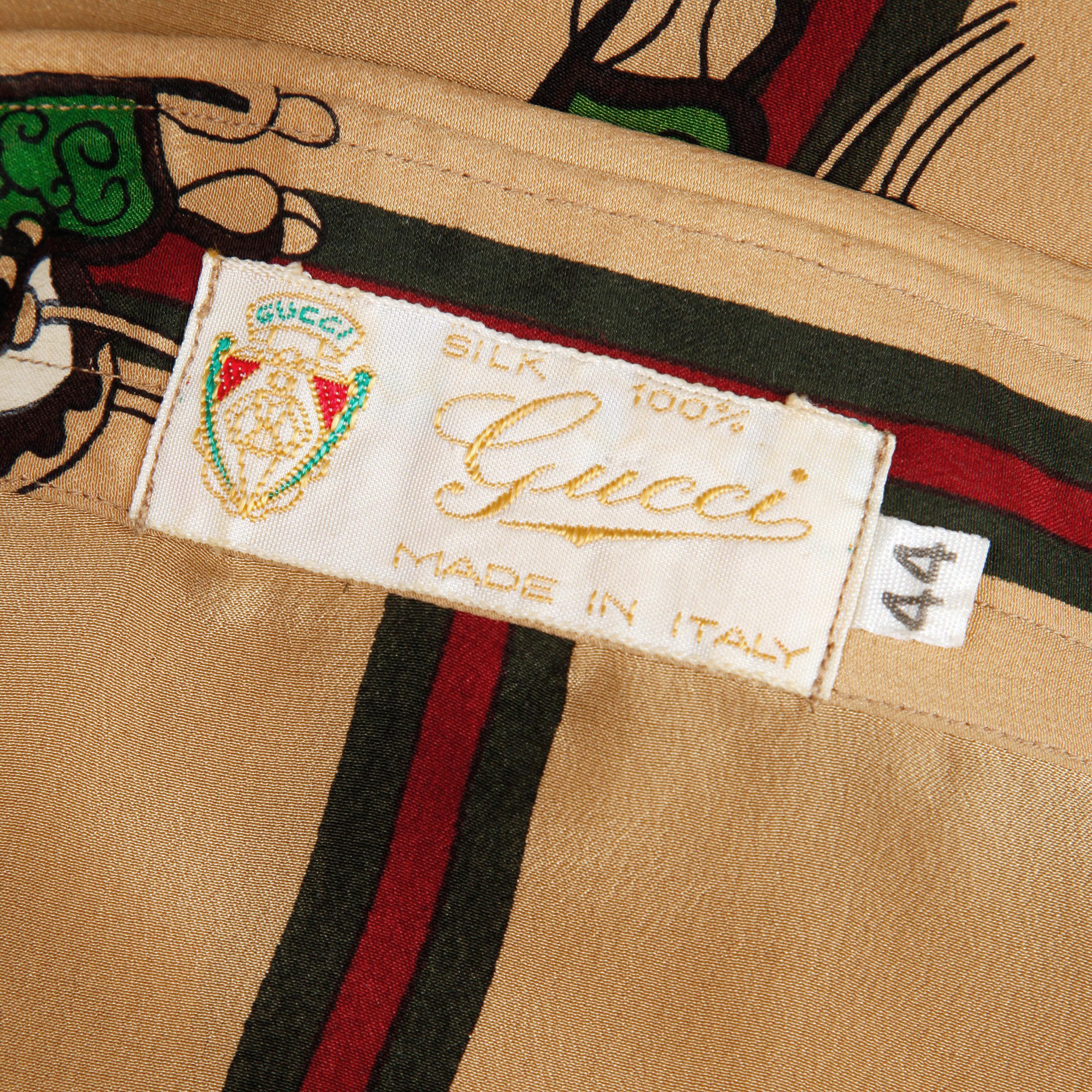 Rare 1970s vintage Gucci blouse with an equestrian-inspired print which features a saddle and the iconic red and green Gucci stripe. From the estate of Pamela Lewis (Jerry Lewis/ Gary Lewis). Covered buttons with metallic 