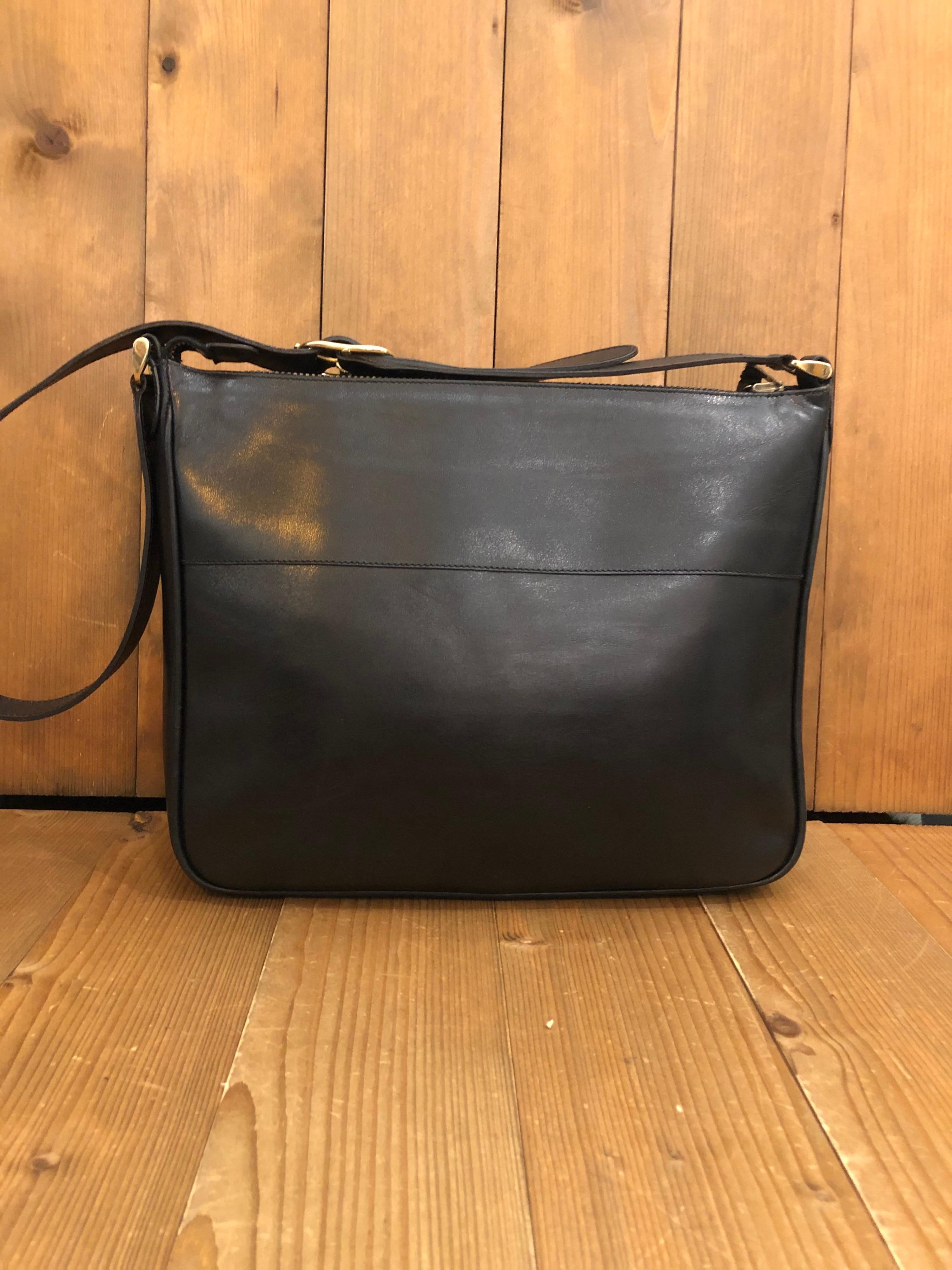 1970s Gucci Web Black Leather Shoulder Bag
Style: Shoulder bag
Material: Leather
Color: Black
Origin: Italy
Measurements: 11.5”x9.5”x3.25” Drop 15”
Specifications: 1 interior zip pocket/1 exterior pocket with flap closure 

Comes with: Dust bag