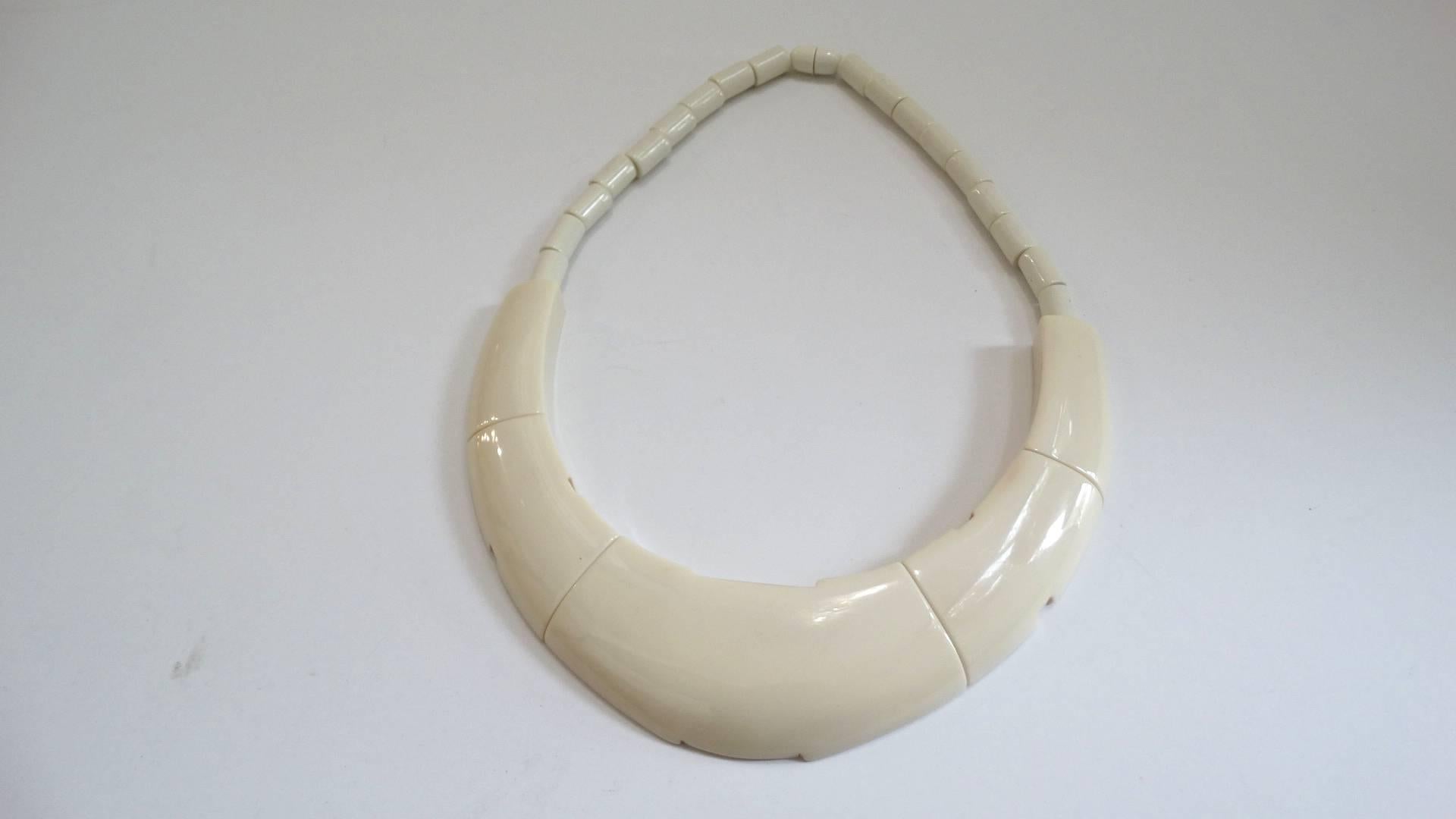 Straight out of the 1970s- this amazing necklace was designed by Francois Schoenlaub’s label “Guillemette L’Hoir- Paris.” Crafted from French bakelite, known as Galalith- in a creamy white color. Futuristic, mod silhouette with unique fractured