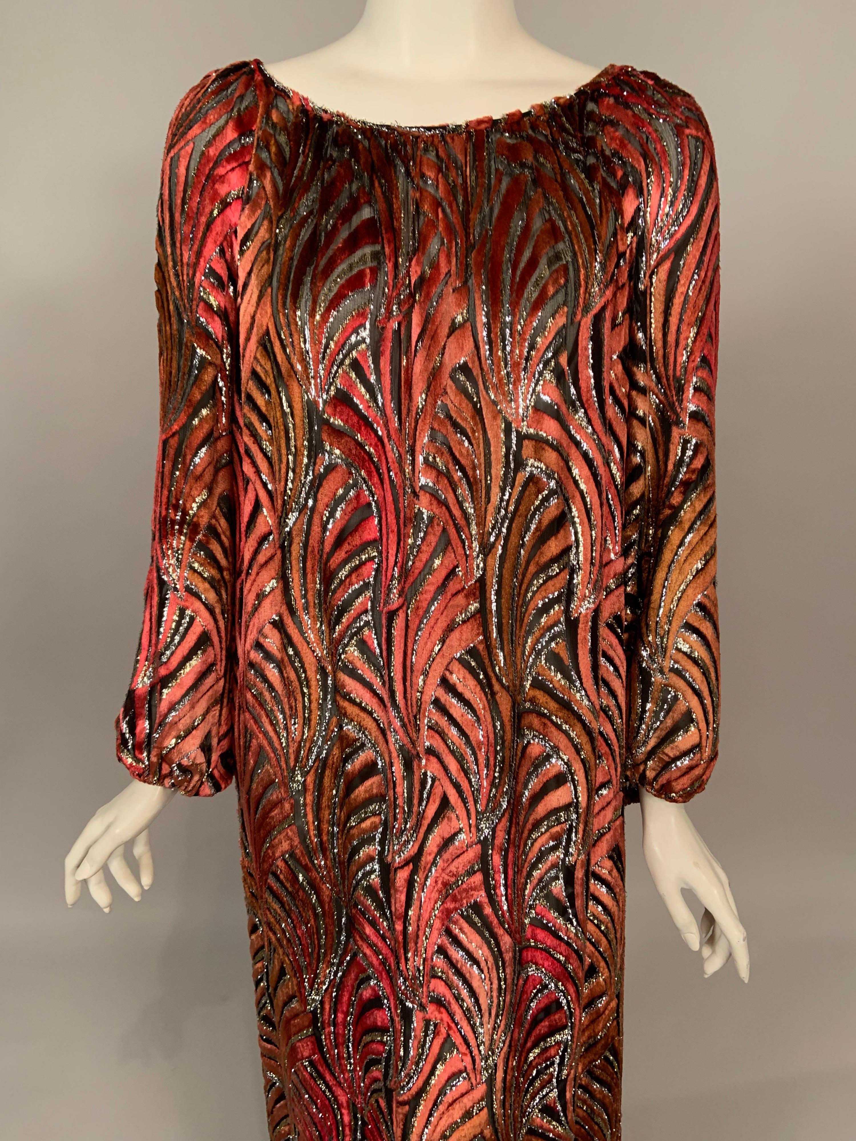 This fabric is so gorgeous! An Art Deco pattern in shades of deep red, cognac and rust is cut to the black silk chiffon background and outlined with gold and silver metallic.  The caftan or dress was retailed by Gump's in San Francisco in the