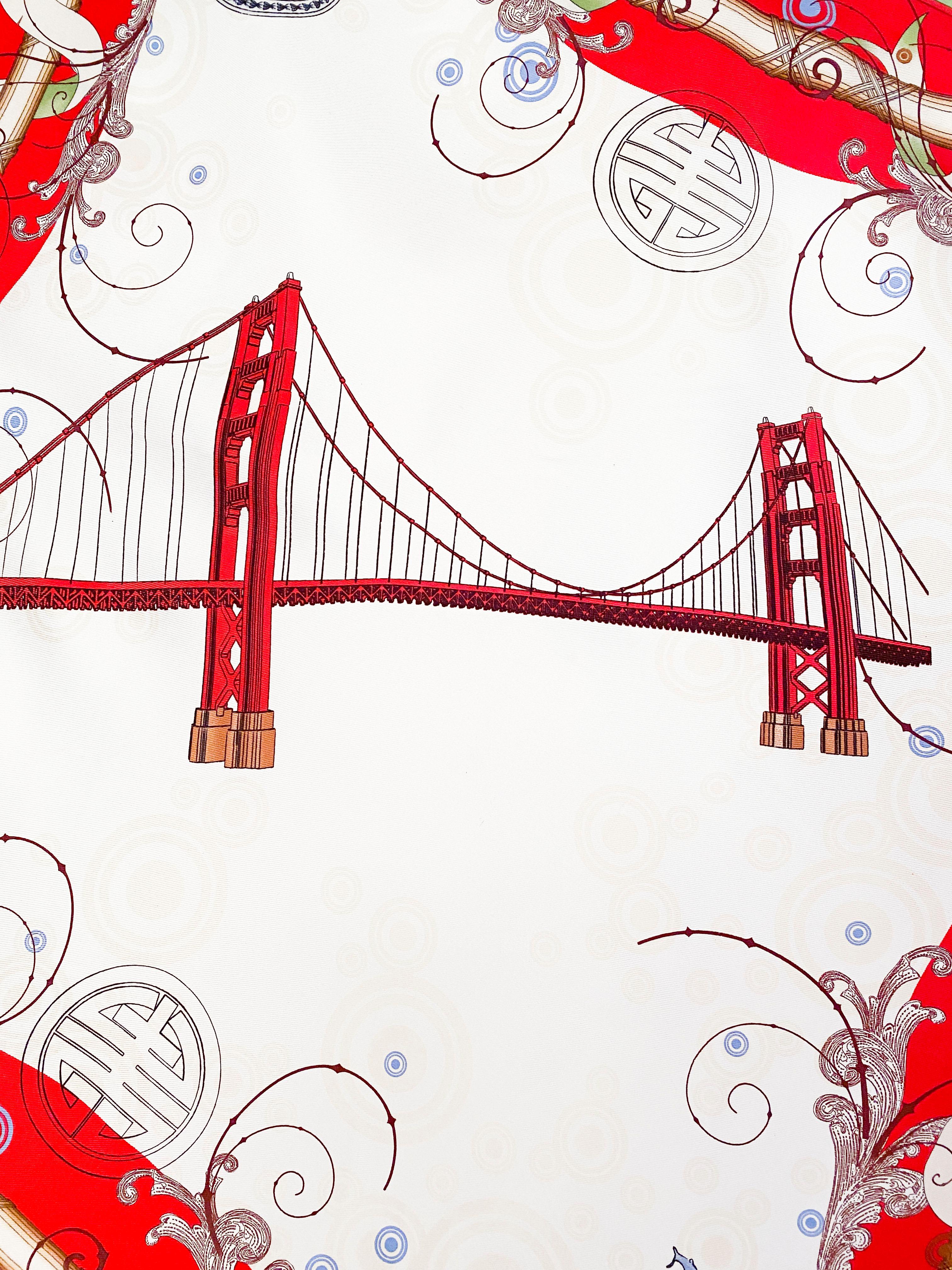 1970s Gump's silk printed scarf featuring San Francisco monuments (Gold Gate Bridge, Coit Tower, Dragon Gate, Trolly Car) with bold red and green boarder.