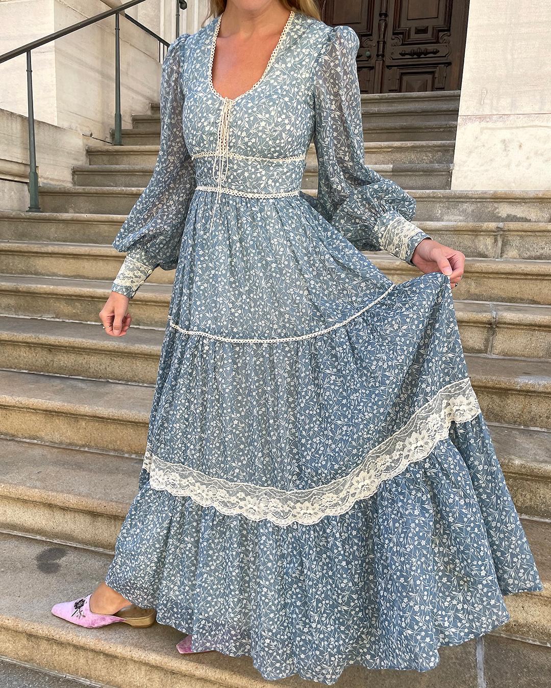 What dreams are made of! In the 1970s, Gunne Sax borrowed heavily from Victorian silhouettes, igniting an entire aesthetic that went on to define the style of an era. This dress is a beautiful example: its crafted from gorgeous sheer floral voile,