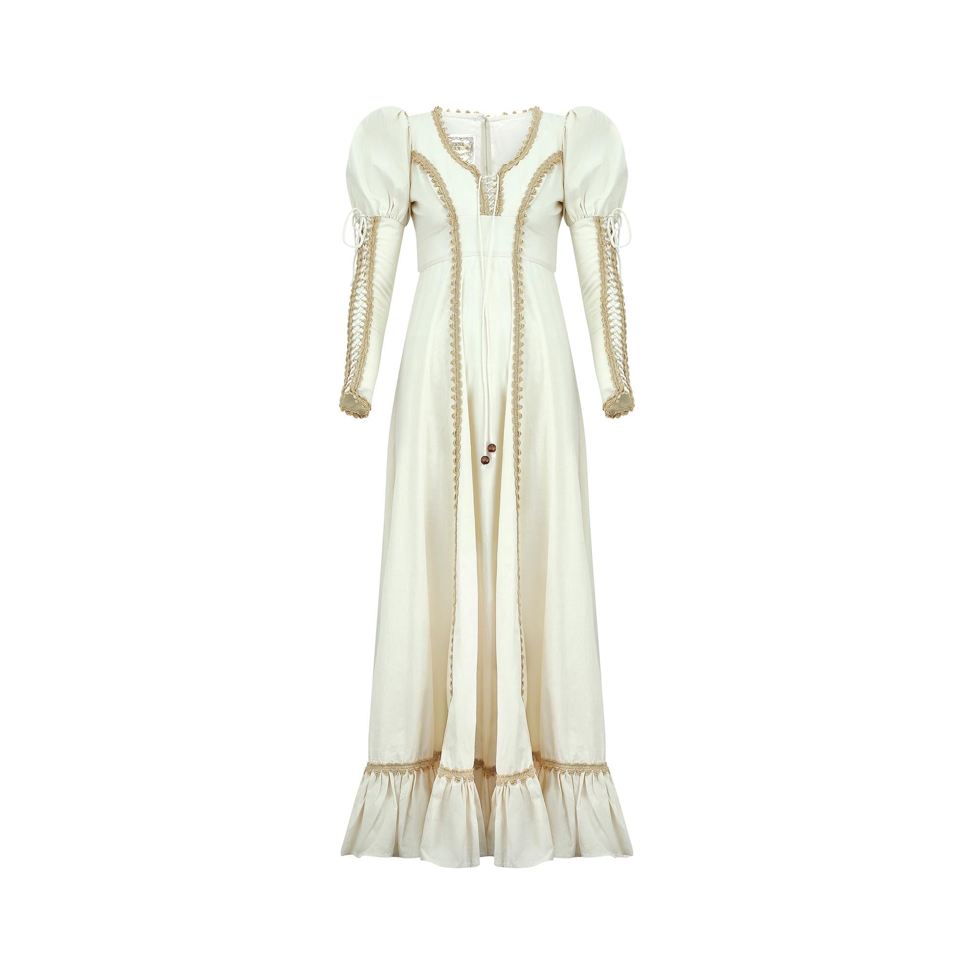 This Gunne Sax by Jessica McClintock dress perfectly embodies the nostalgic hippie trends of the early to mid 1970s.  Full length and elaborate, this is one of the more expensive medieval inspired gowns composed of a non-stretch, unbleached poplin