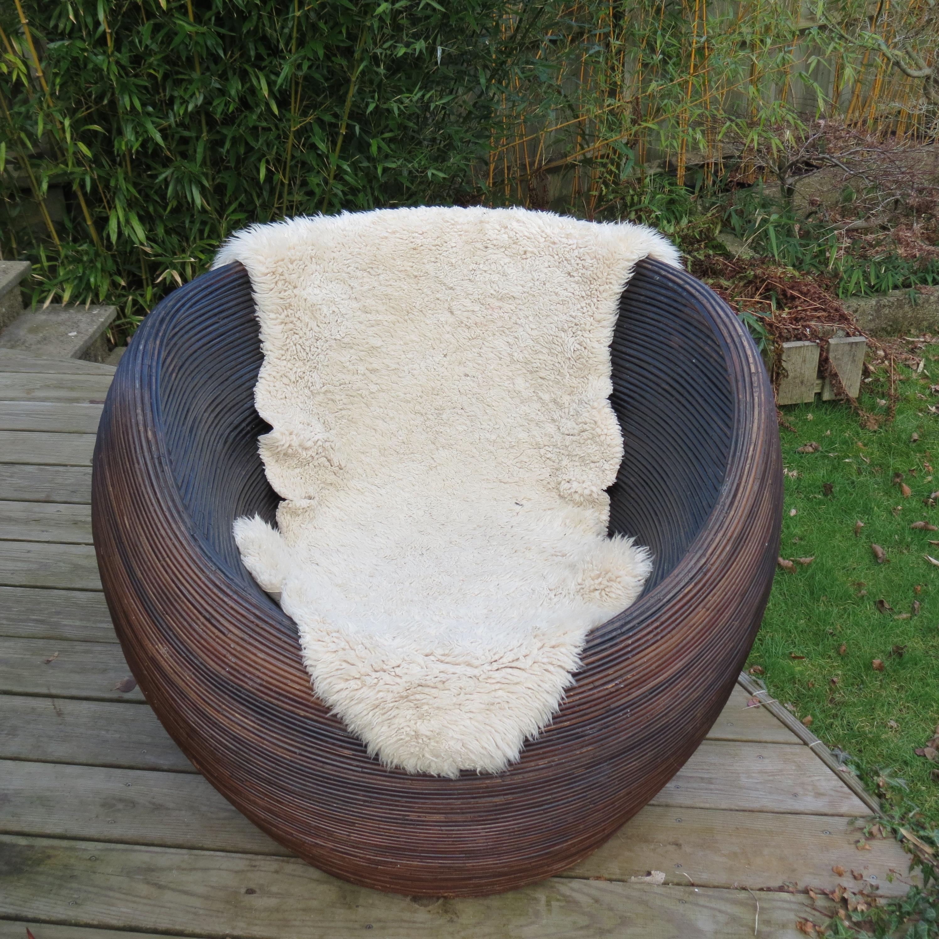 A great garden or easy chair from the 1990s. Designed and retailed by Habitat, this chair can be used indoor or outdoor. Wonderful spherical shape, made from rattan, would originally have had a removeable vinyl pad seat, this is no longer with the