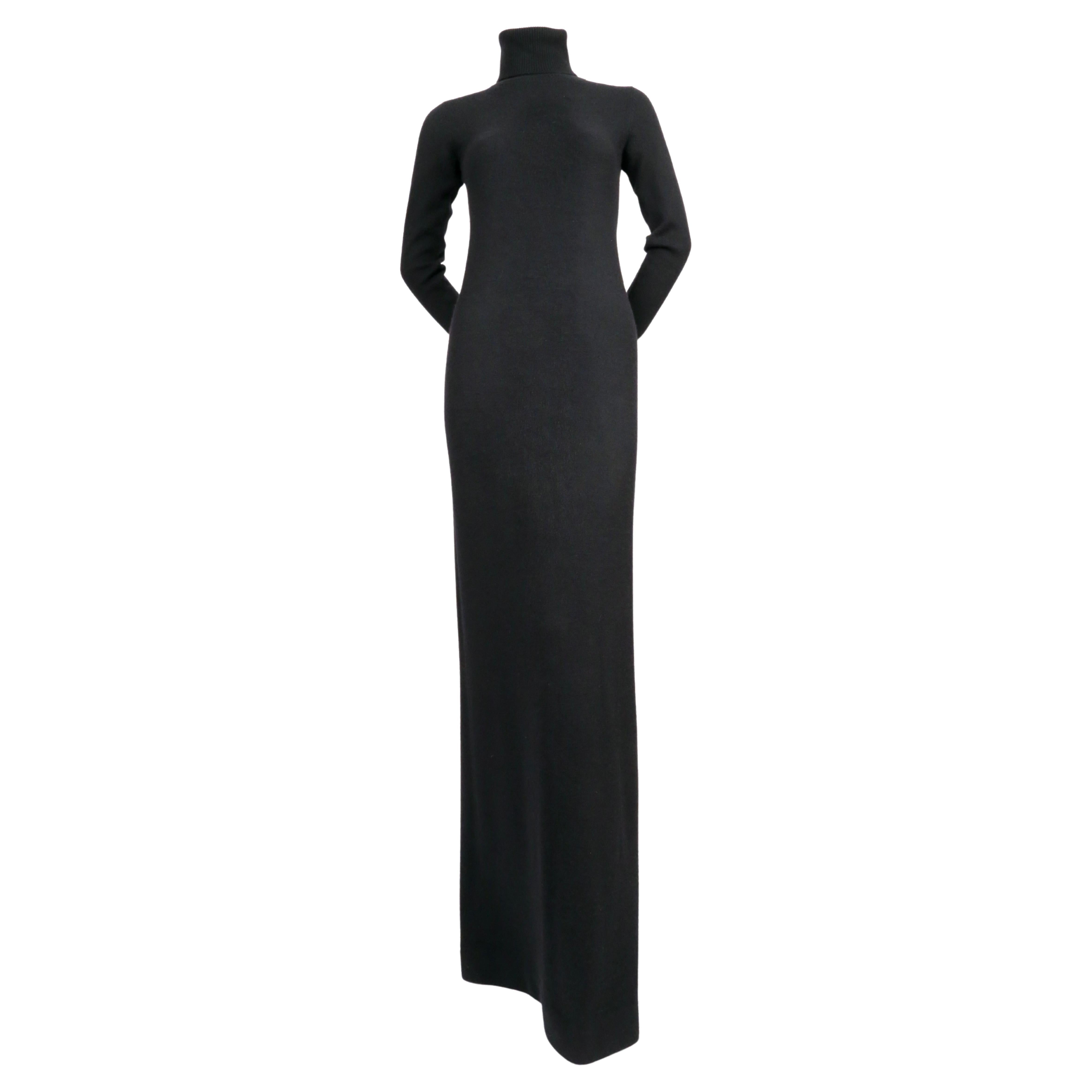 Very rare, extra long, black cashmere dress with turtleneck from Halston dating to the 1970's. Labeled a size M. Best fits a small or medium. Approximate measurements (unstretched): shoulder 13.5
