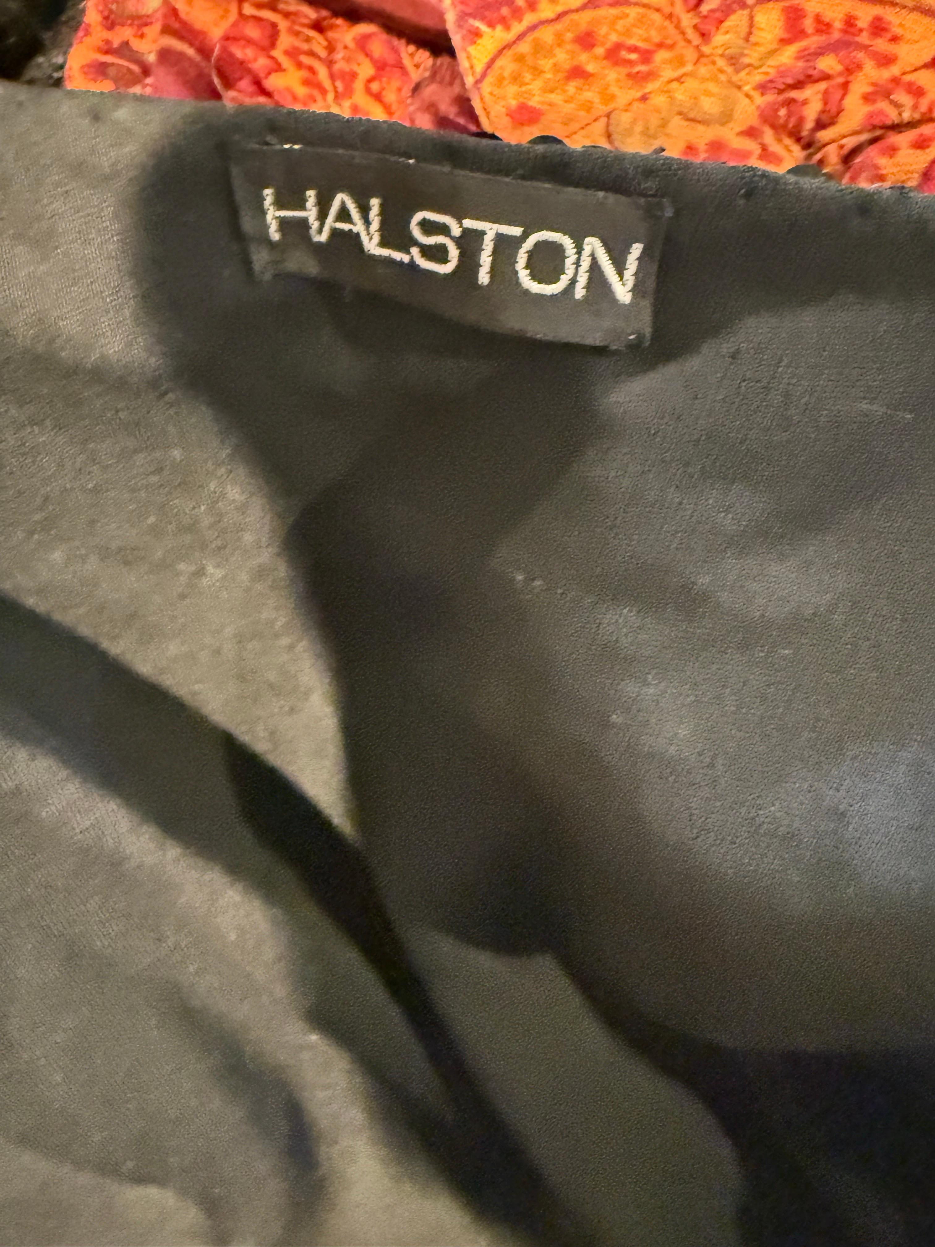 A rare and glamorous 1970s Halston black sequin wrap dress, the epitome of Studio 54 chic. Designed with Halston’s signature minimalist sophistication, this dazzling piece is fully covered in hand-applied sequins that catch the light beautifully