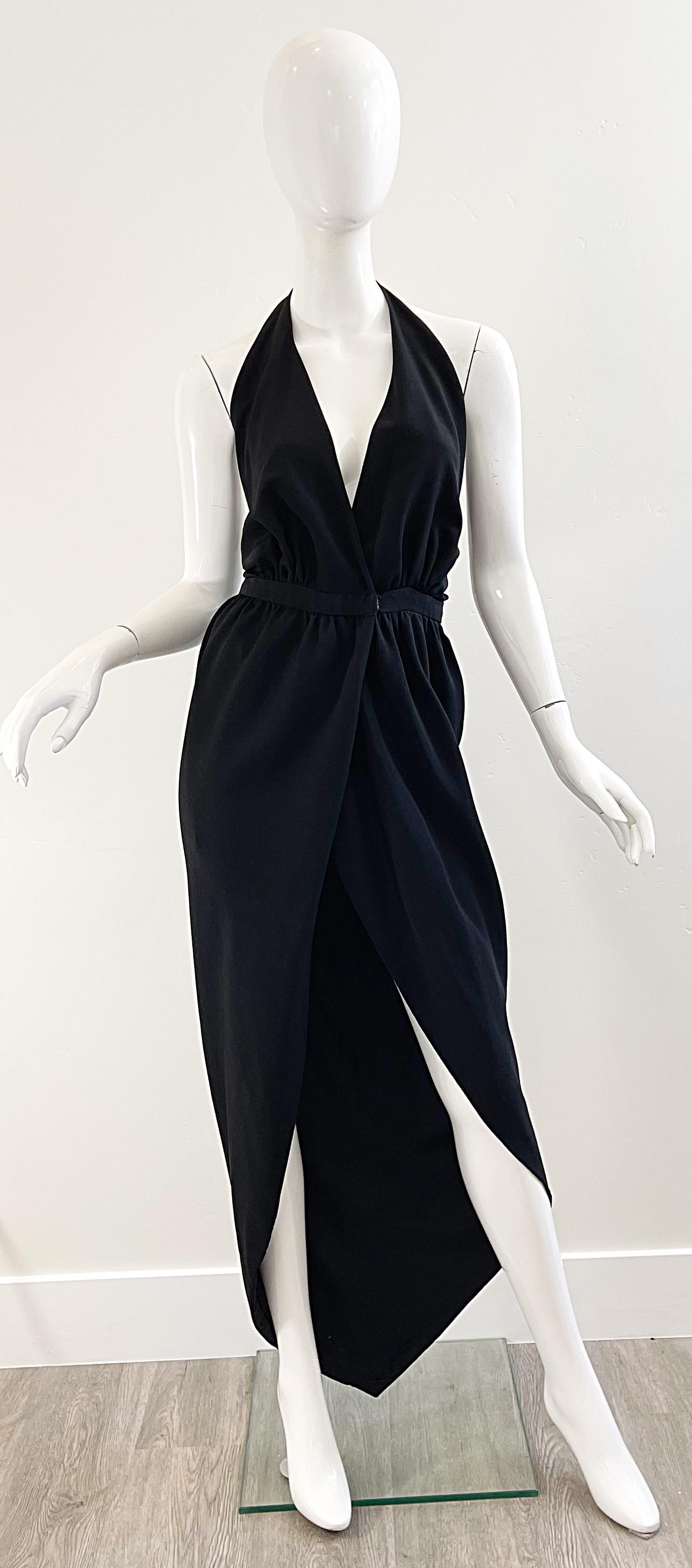 Sexy and iconic 70s HALSTON black silk crepe tulip hem wrap halter maxi dress ! Low plunging bodice with skirt that wraps with hidden hook-and-eye closure. Such a flattering fit with a dip tulip hem. A perfect timeless black gown that will only