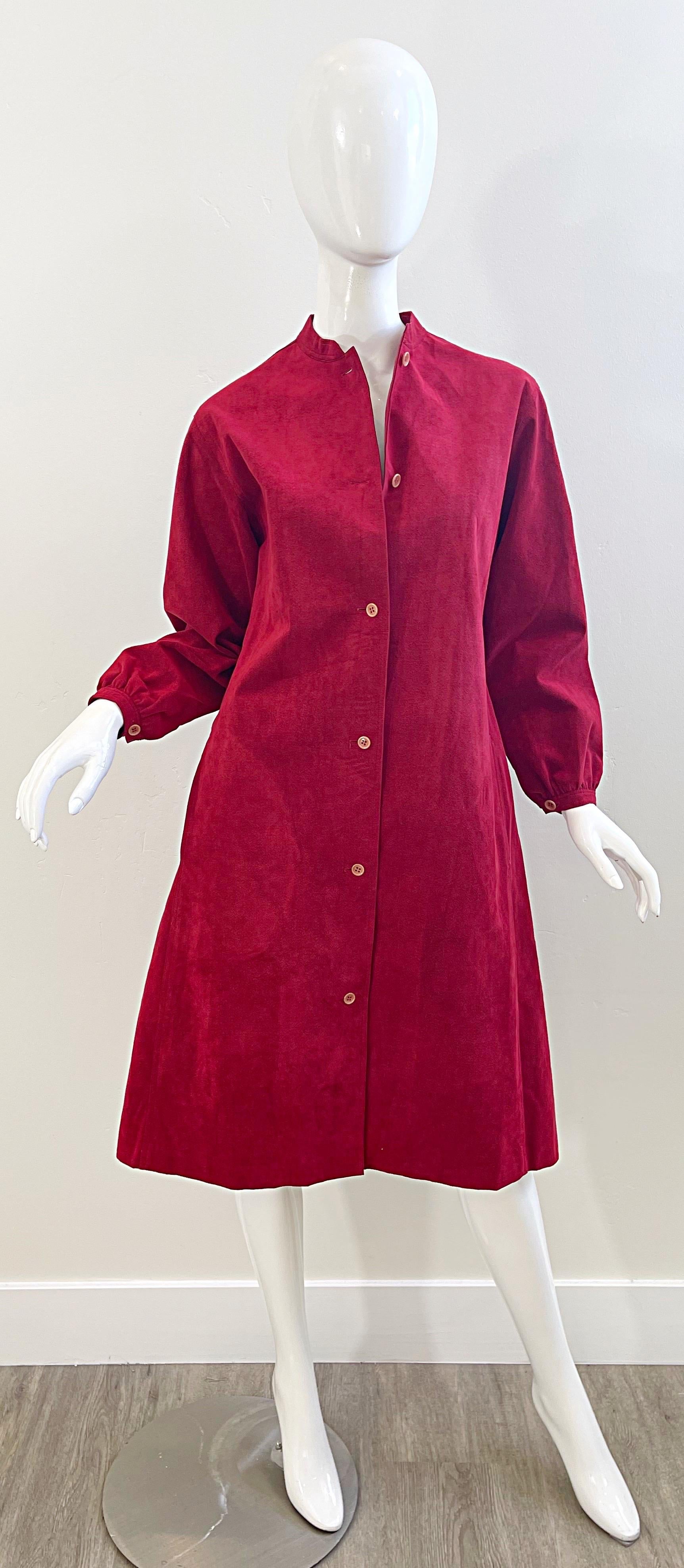 Chic vintage 70s HALSTON crimson red ultra suede long sleeve shirt dress ! Buttons up the front, and can also be worn as a duster. Pockets at both side of the hips. Dress this classic beauty up or down. The black alligator embossed Jane August belt