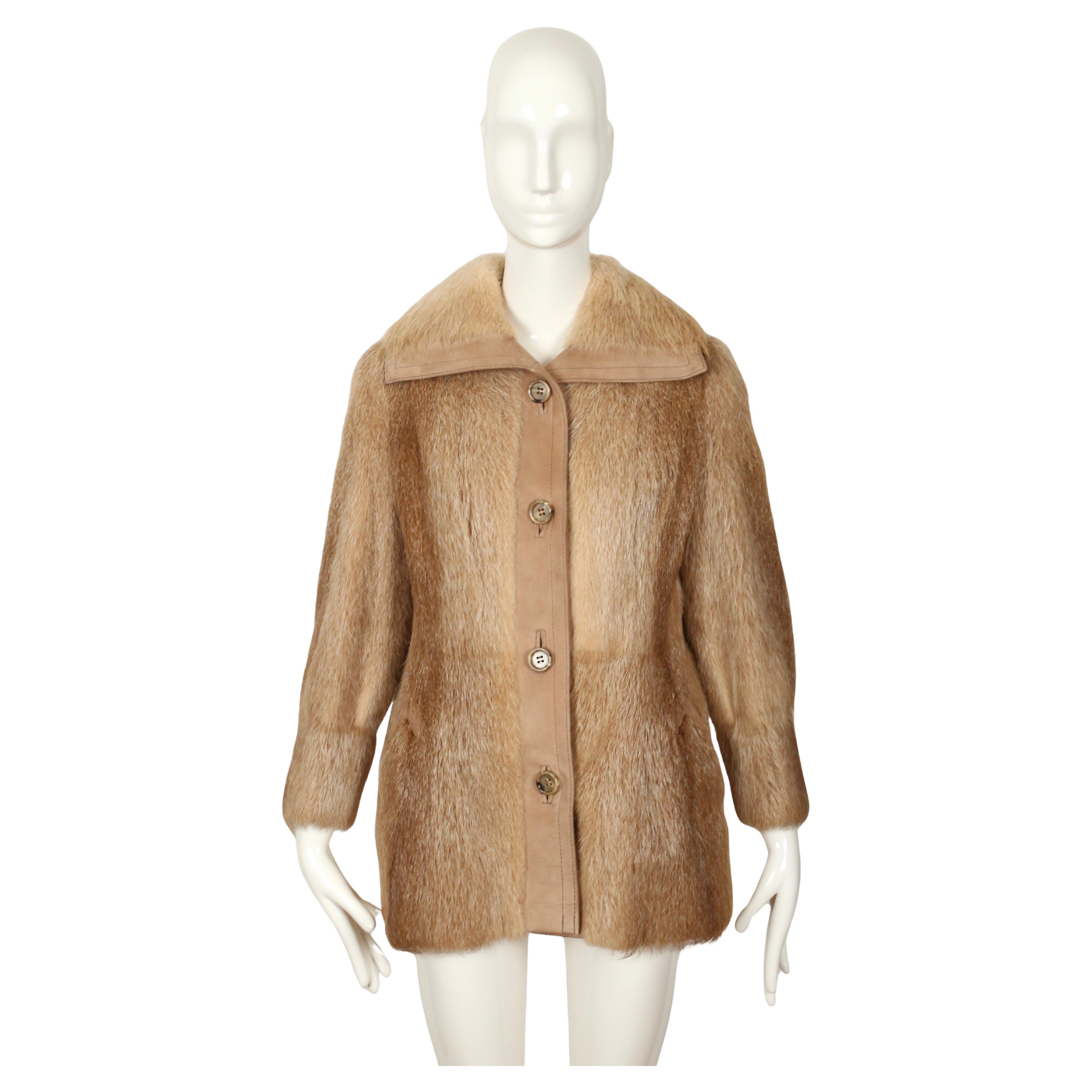 Nutria fur coat with large collar and suede trim from Halston dating to the late 1970's. Fits a size 4 or 6. Approximate measurements: 15