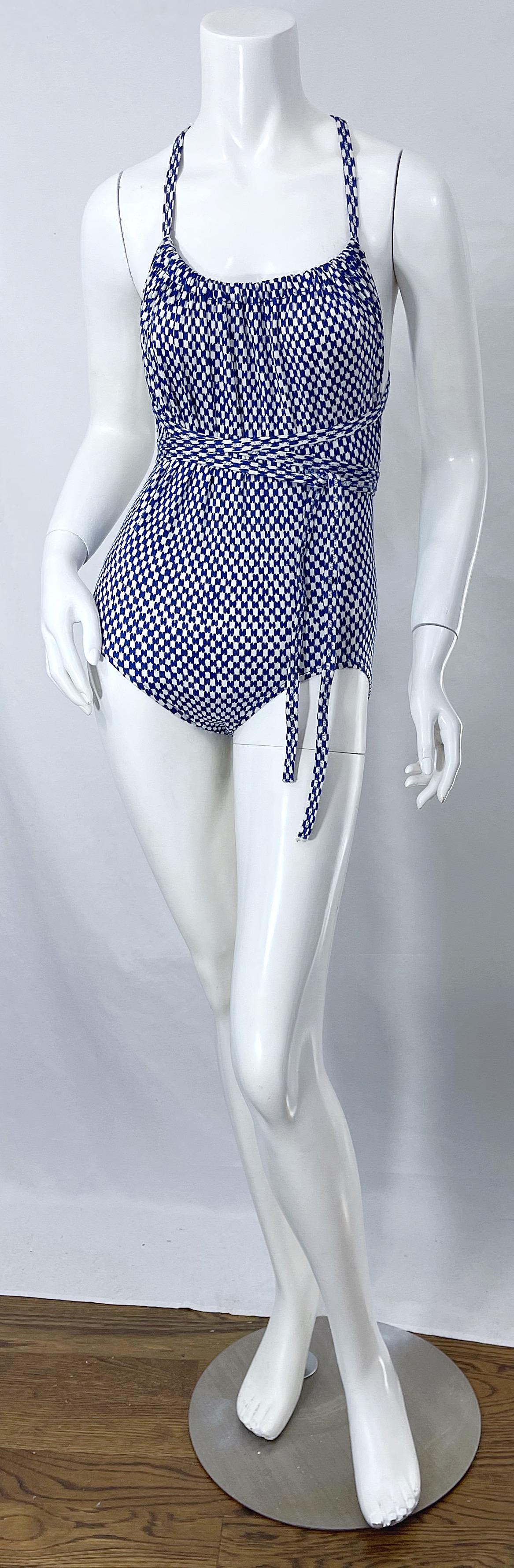 Rare and collectible HALSON 1970s blue and white logo print one piece swimsuit ! Features the signature H logo print throughout. I recently acquired five Halston swimsuits from a former Halstonette model. This is one of them. Halter style wraps