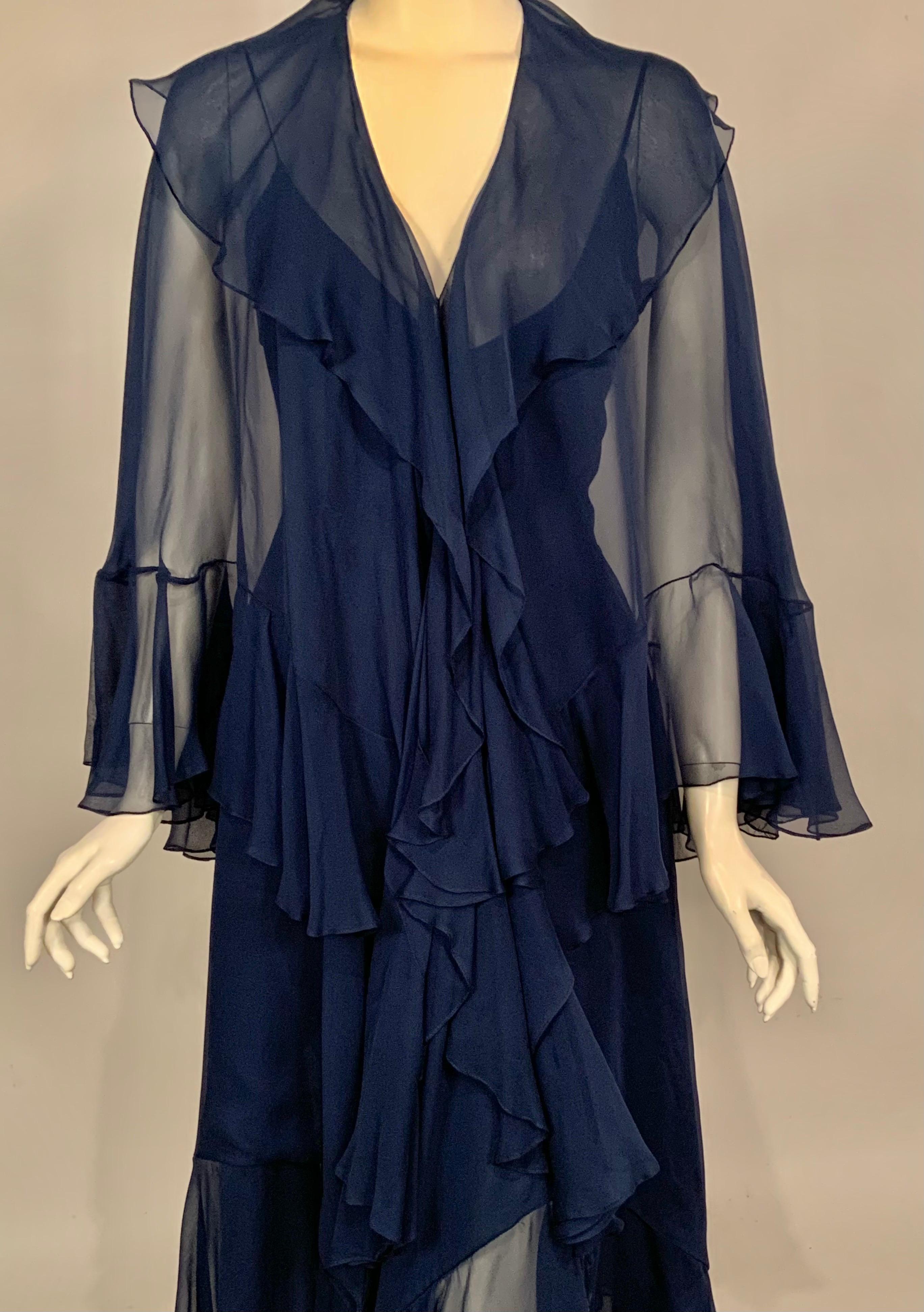 This is a stunning two piece outfit designed by Halston in the 1970's, I can just picture it being worn at Studio 54.   The dress is bare, with spaghetti straps, a fitted bodice and a fabulous skirt with a handkerchief hem.  The matching cape has a