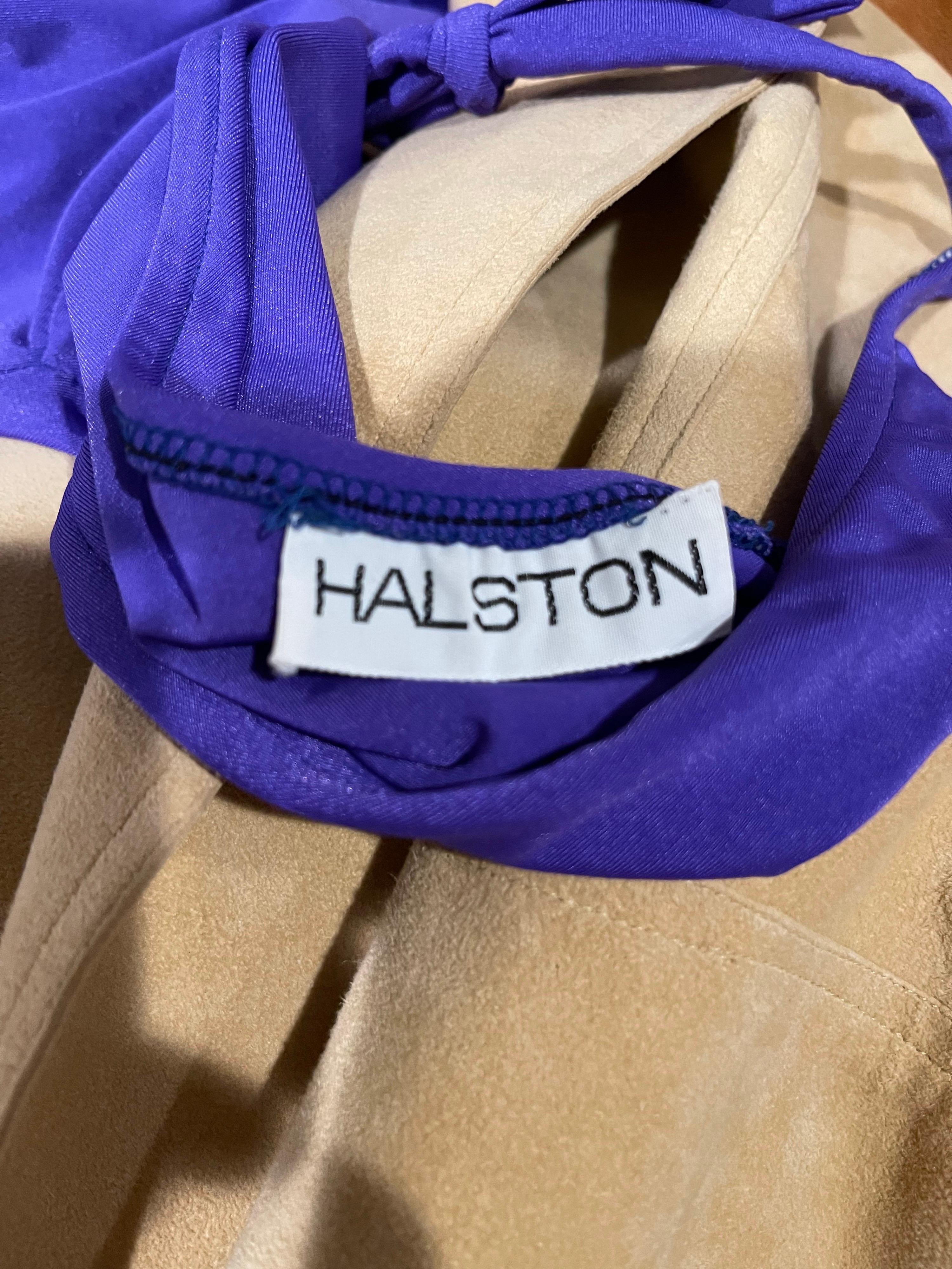 Rare and sexy 1970s HALSTON purple one piece plunging halter swimsuit OR bodysuit ! Beautiful purple jewel tone color. This rare beauty is one of 6 Halston swimsuits that I recently acquired from an original Halstonette model. 
Great for the beach,