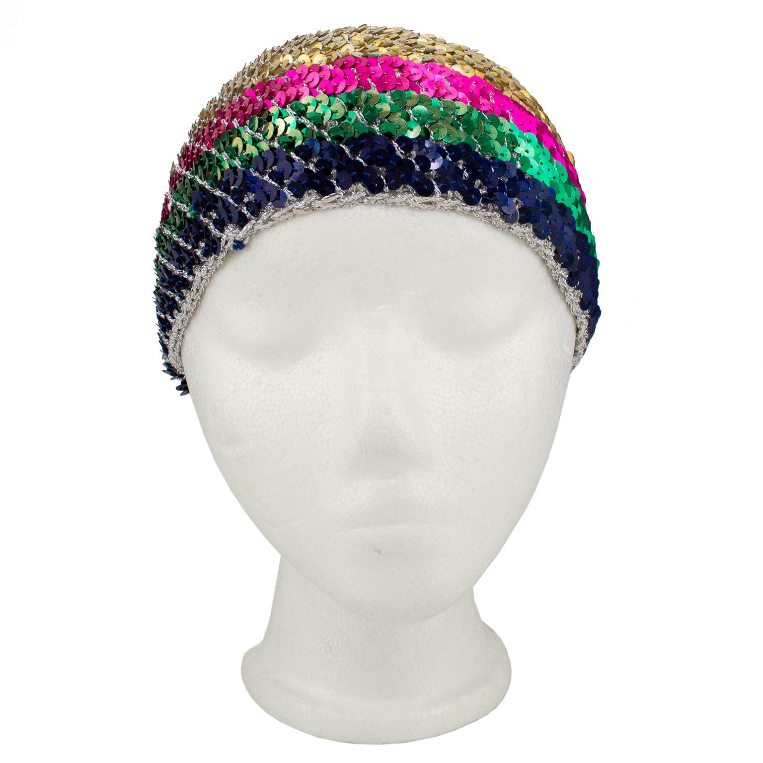 Roy Halston Frowick began his career as a hat designer. He was best known for his pillbox style creations before expanding into women's wear and revolutionizing the way his jet set clients dressed for daytime to disco nights. This rainbow sequin and