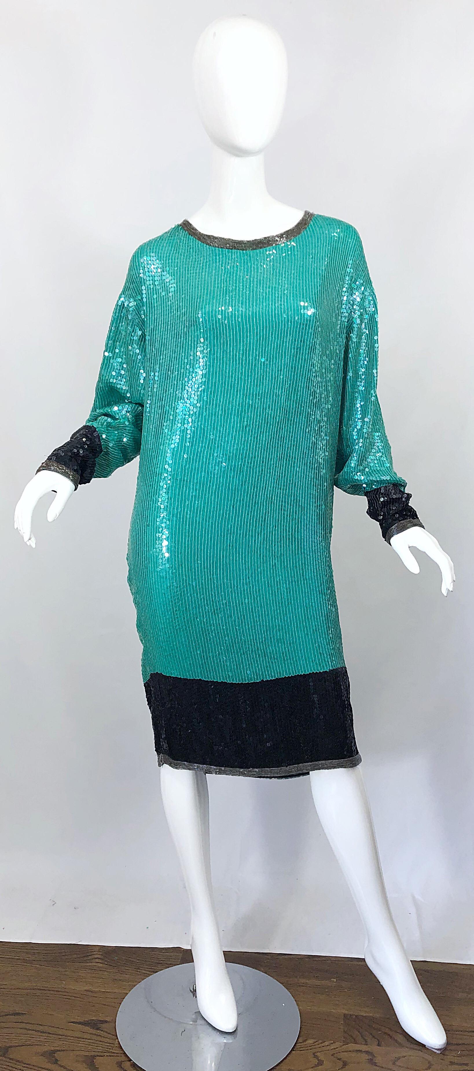 Amazing vintage late 70s HALSTON teal blue/green and black silk sequined and beaded dolman sleeve dress! Features multiple layers of the finest silk chiffon with thousands of hand-sewn sequins and beads throughout the entire dress. Black sequined