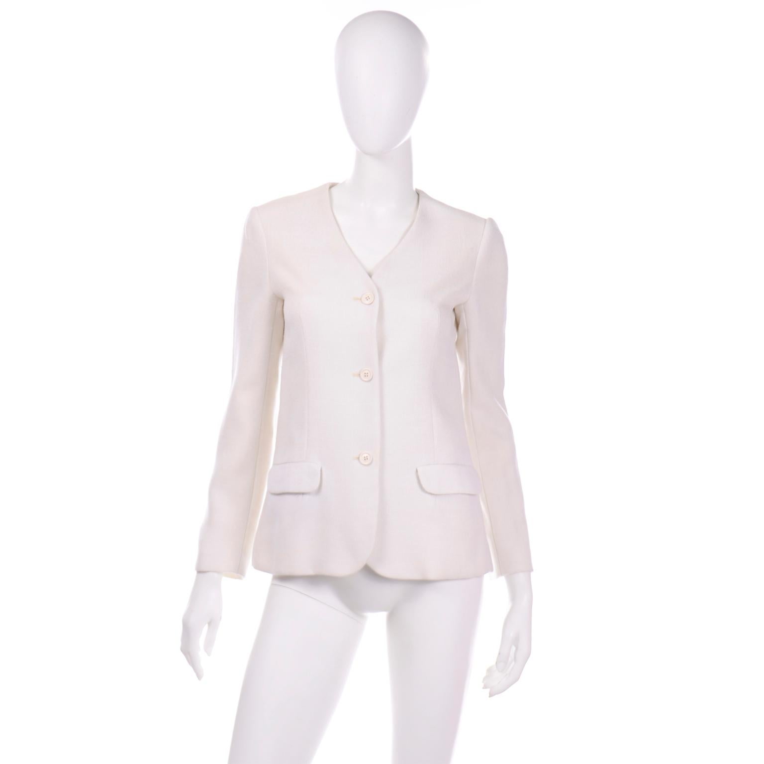 This is a versatile, late 1970's crisp ivory linen Halston vintage  jacket with a v-neckline. The front opening has ivory buttons and there are two front flap pockets and the jacket is cut in the familiar Halston style with all of the subtle details