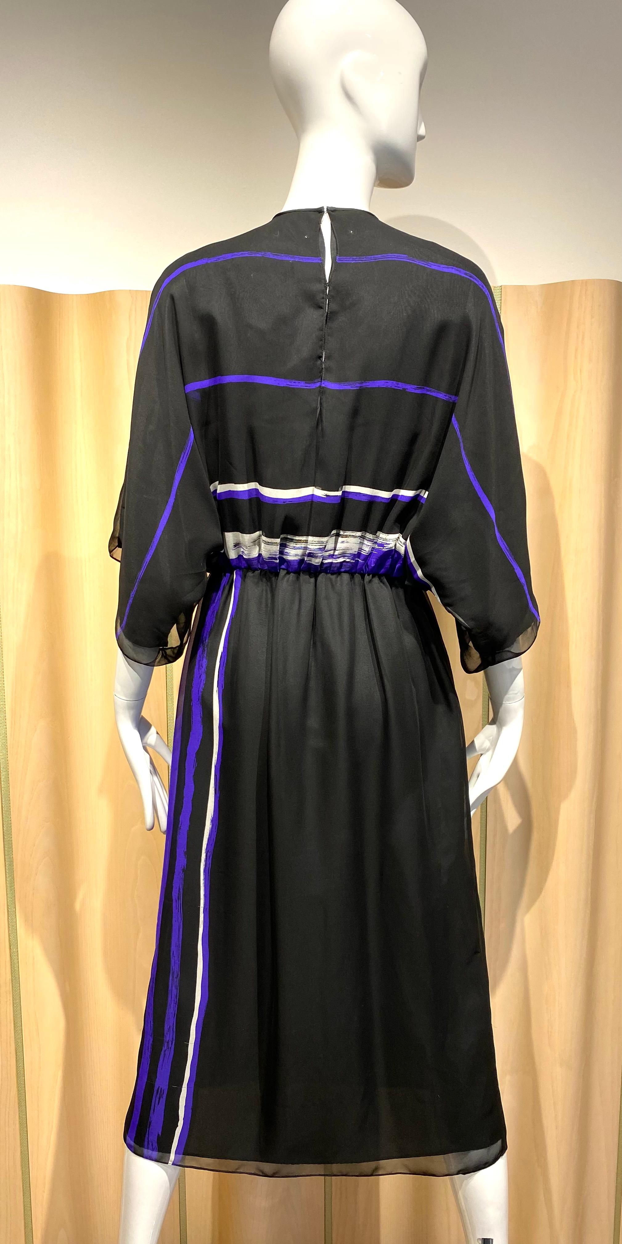 1970s Hanae Mori black and purple crepe dress with sash.
Size Medium
Elastic waist.  Dress fit size 2/4/6