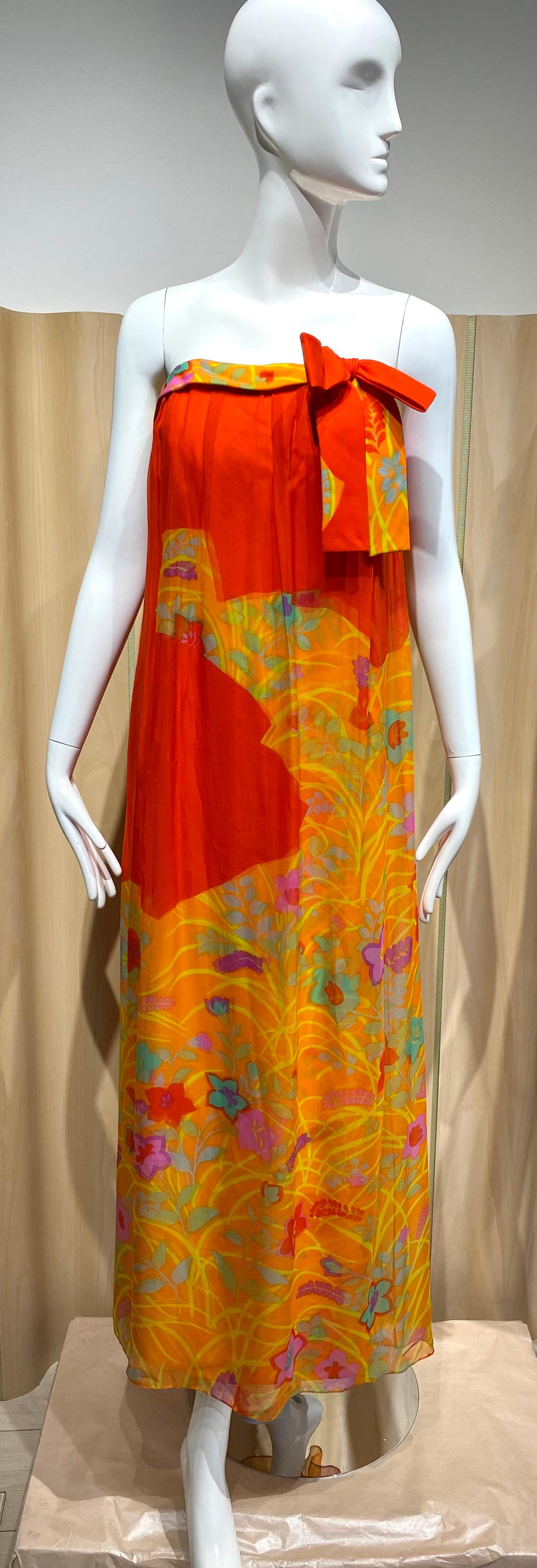 1960s Hanae Mori Silk - Begdorf Goodman Tangerine floral print silk strapless gown with bow and shawl.
Dress measurement :
Bust : 34 inches / Waist : 28 inches/ Hip 36 inches
Dress length 48 inches/ Silk outer layer is 64”

***flaws tiny pinholes