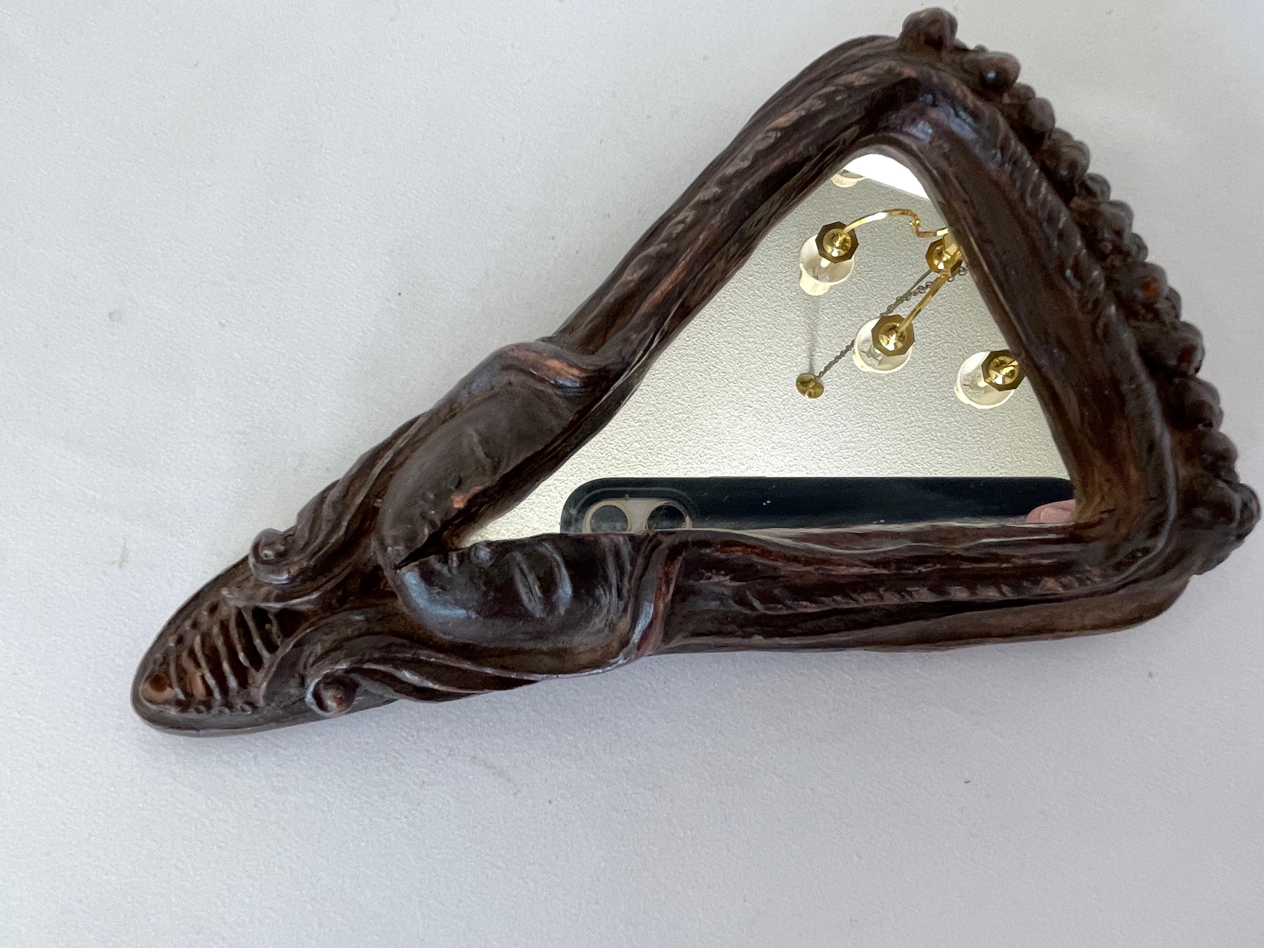 1970's Hand Carved Face Scuplture Resin Mirror In Good Condition For Sale In New York, NY