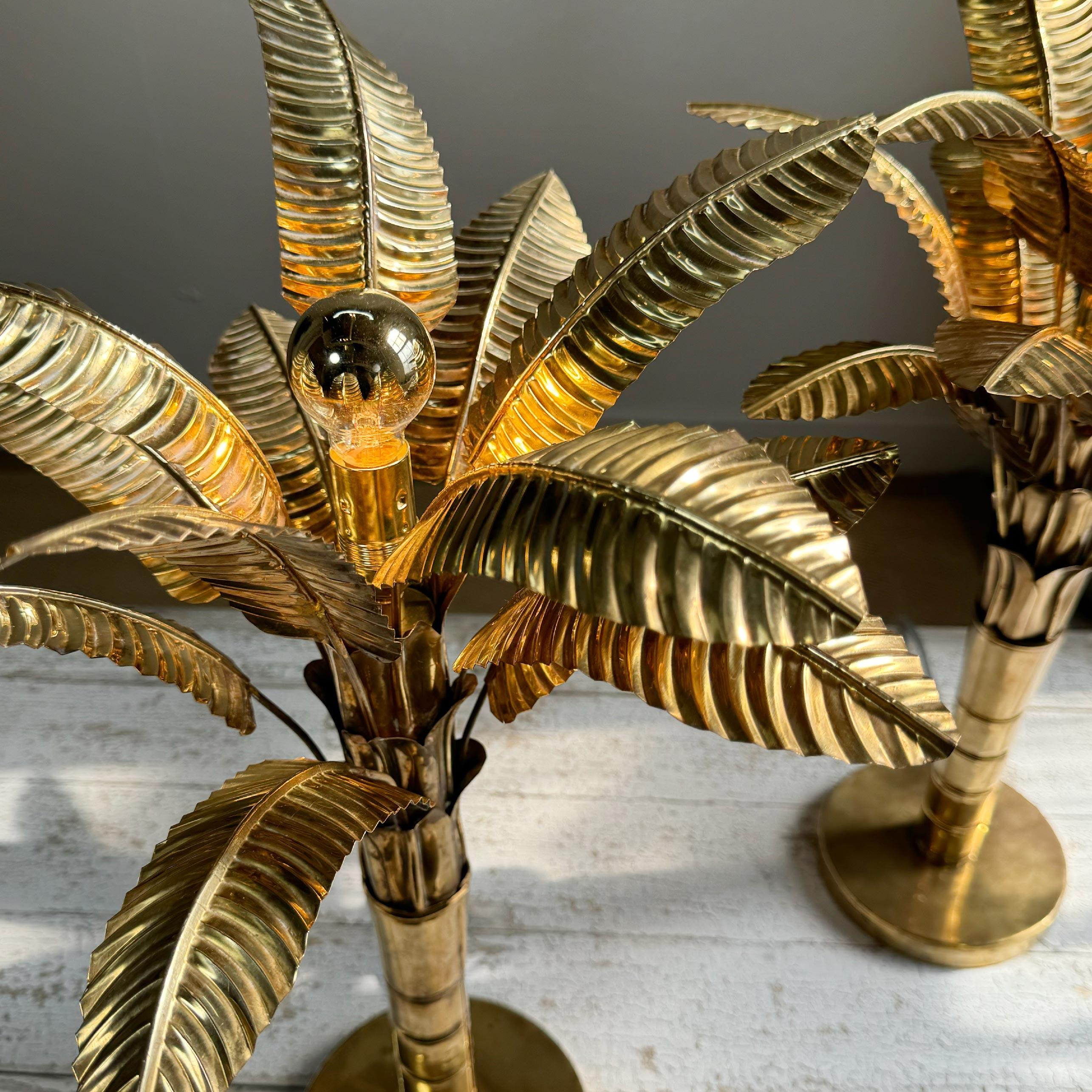 Beautiful pair of 1970's hand crafted French table lamps, modelled in brass as banana / palm trees, each lamp has 12 detachable leaves and a single e14 (small screw in) gold Edison lamp holder. We have managed to source 2 of these exceptional and