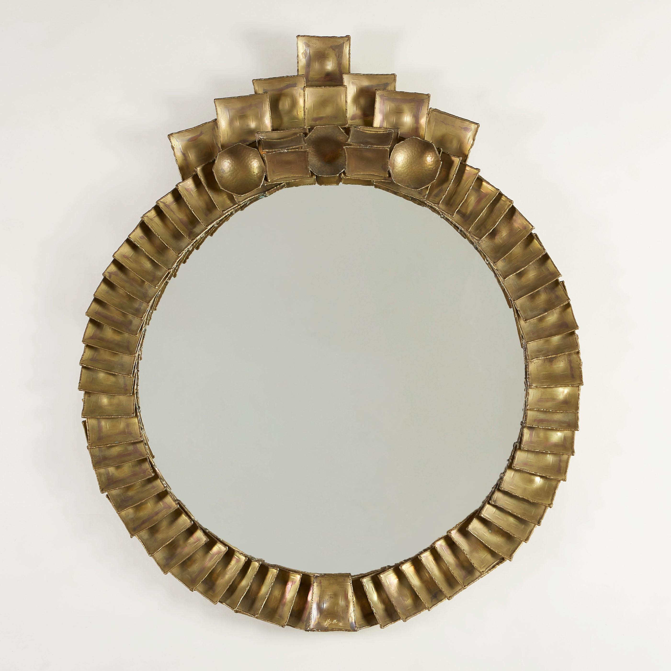 Striking and Imposing brass mirror designed from overlapping shaped burnished brass pieces. Signed Giertta.

Claës Giertta (1926-2007) was an influential silversmith, sculptor and designer in Sweden highly regarded for his experimentation with