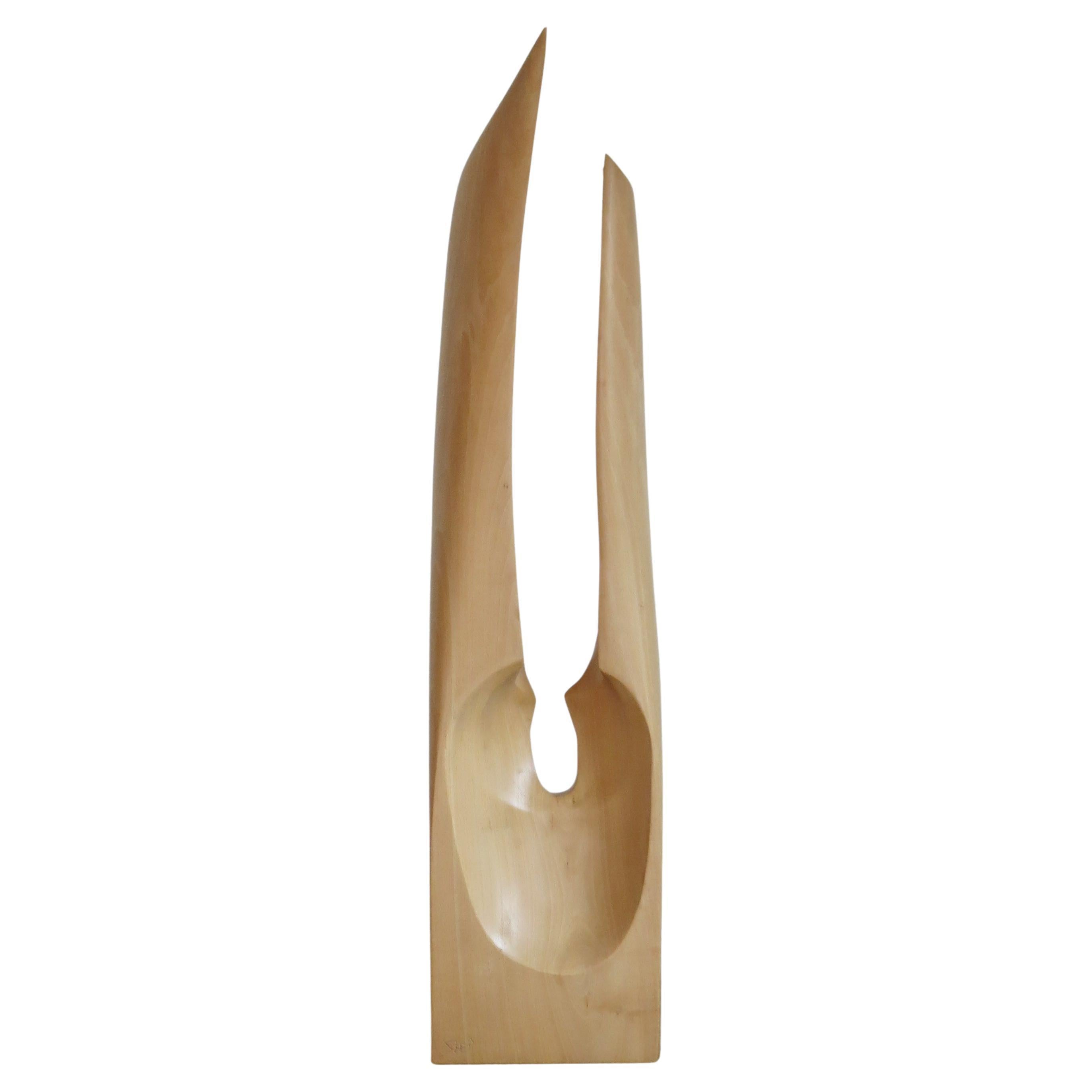 Wonderful hand crafted wooden sculpture dating from the 1970s. Made from solid Lime, beautifully hand carved, with a Barbara Hepworth influence. 
In good vintage condition, the colour of the wood has warmed and mellowed over time. 
Signed PKW