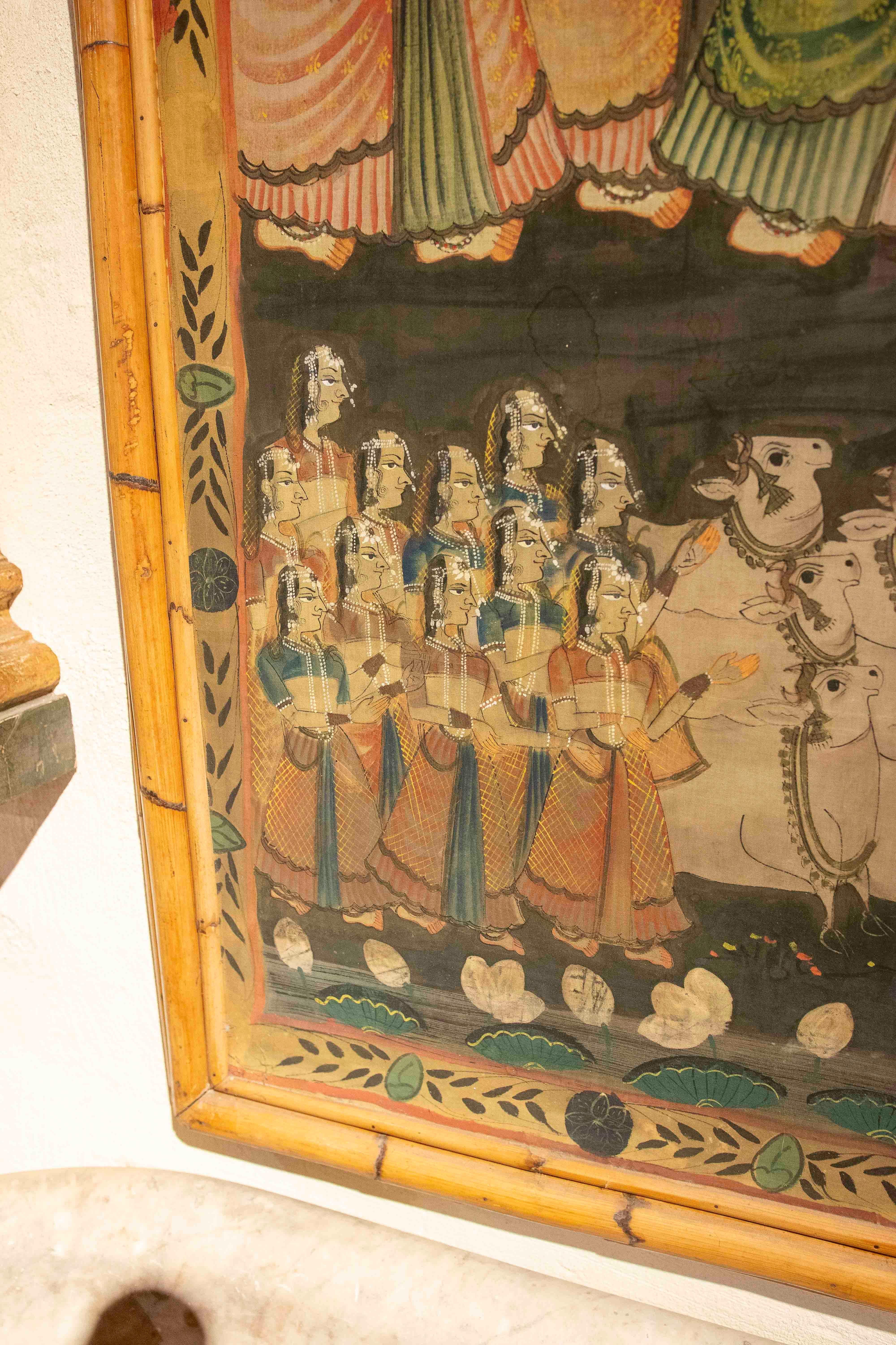 Indiano Pittura su tela dipinta a mano degli anni '70 con personaggi dell'Indo e cornice in bambù in vendita