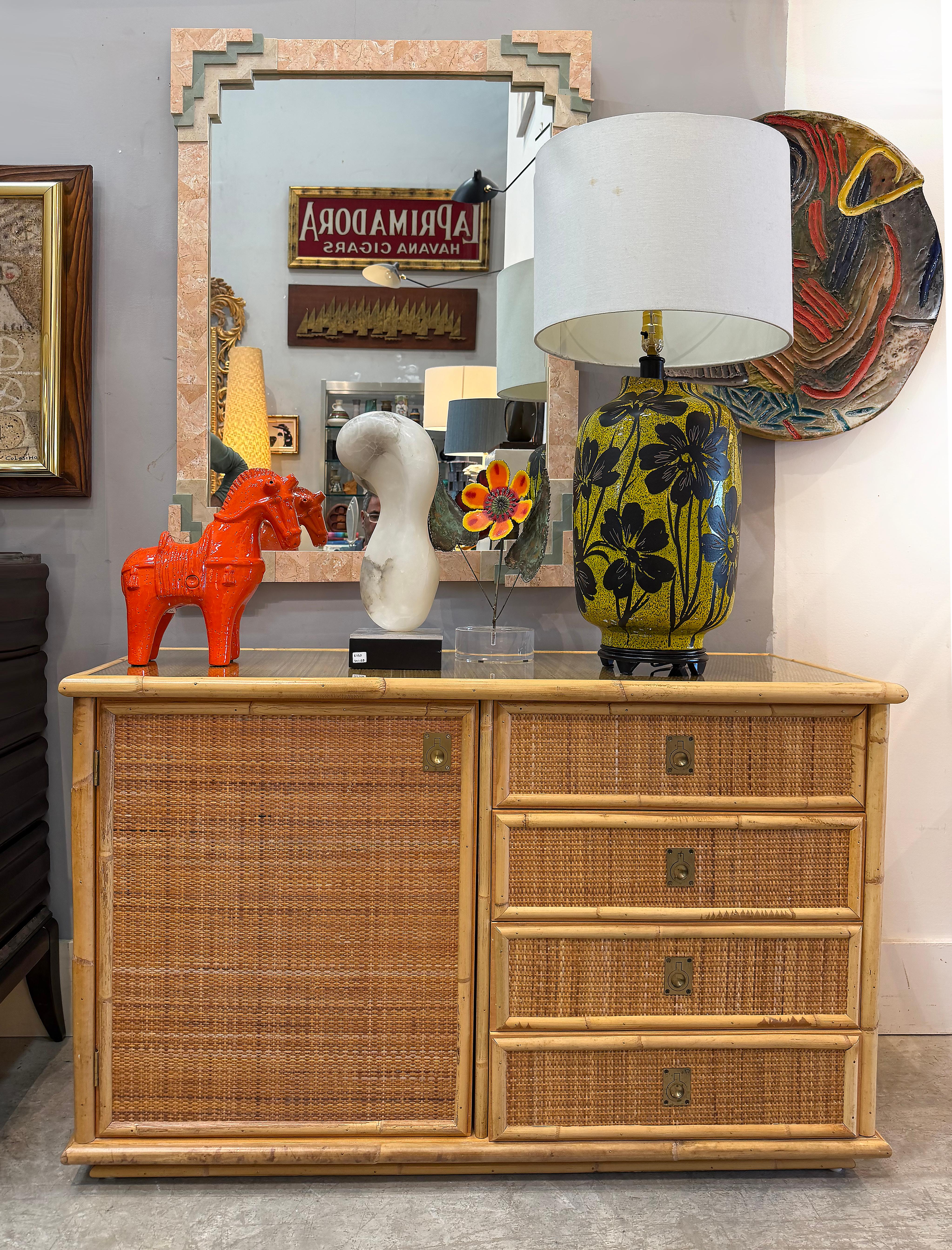  1970s Hand Woven Rattan Cabinet by Dal Vera, Made in Italy 

Offered for sale is a vintage 1970s rattan cabinet made in Italy by Dal Vera. This well-made rattan cabinet has solid all wood interior framing and a removable shelf. The cabinet is clad