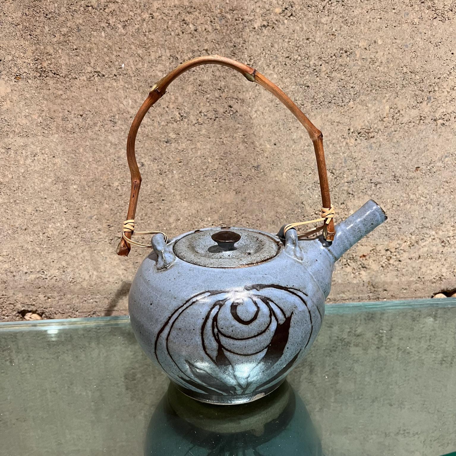 1970s Handcrafted Small Blue Tea Pot Studio Pottery Art 
Signed at bottom
11 h to tip of handle 6 h pottery x 6 w x 8.5 d
Preowned original unrestored vintage condition.
Refer to images provided.

