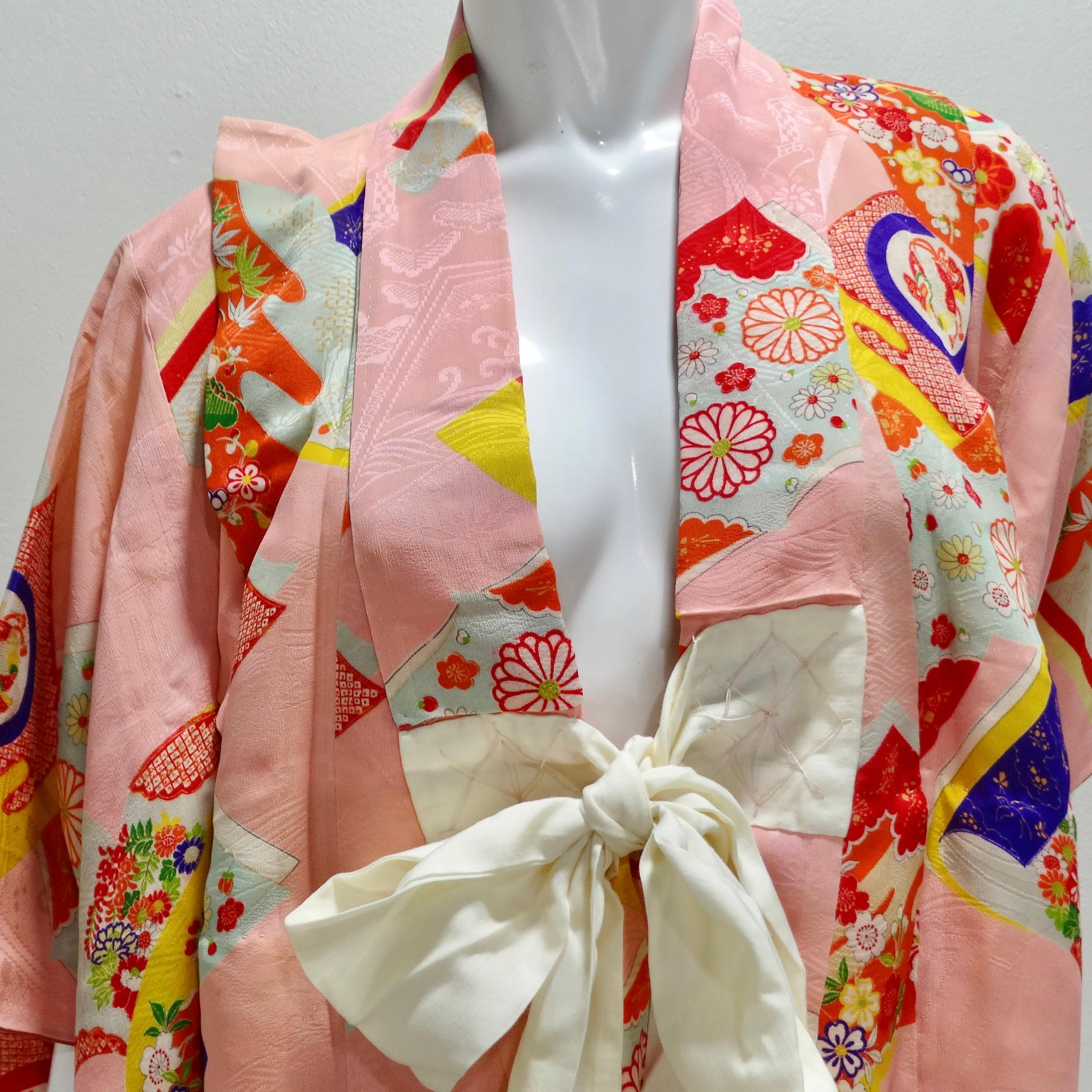 Introducing the 1970s Handmade Japanese Multicolor Silk Kimono—an exquisite and whimsical treasure that captures the essence of traditional Japanese artistry and craftsmanship. This handmade kimono is more than a garment; it's a wearable canvas of