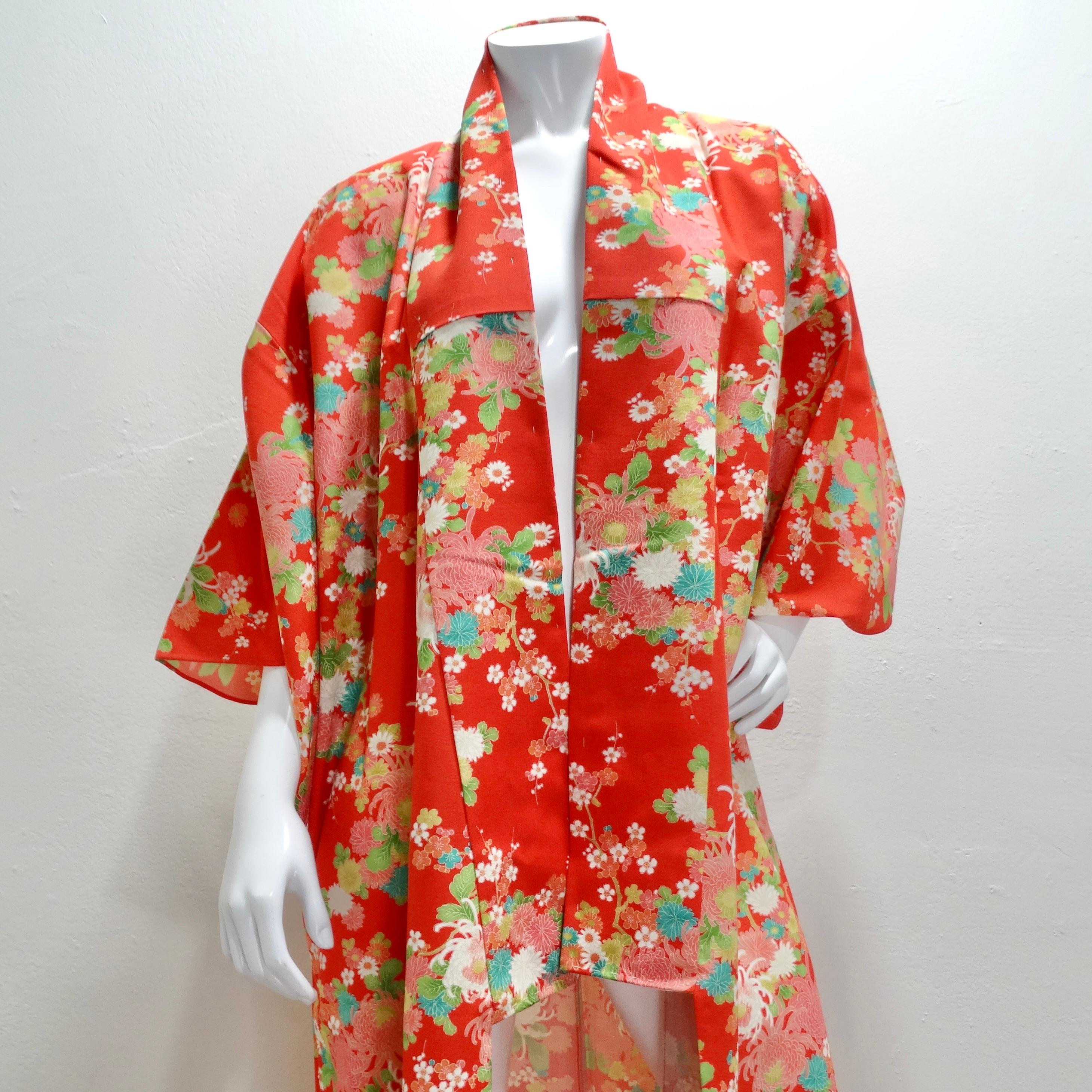 Introducing the 1970s Handmade Japanese Red Floral Long Kimono—a breathtaking and unique treasure that beautifully encapsulates the artistry of traditional Japanese craftsmanship. This handmade kimono is not merely a garment; it's a wearable canvas