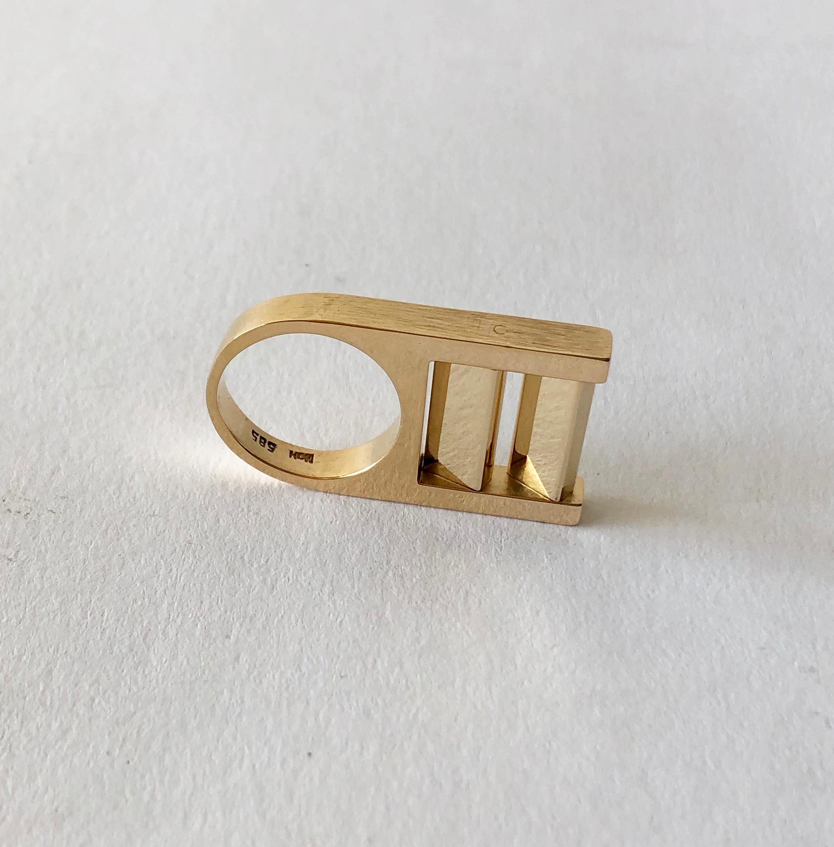 Danish modern 14K gold kinetic ring created by Hans Hansen, circa 1970's.  Ring is a finger size 5 - 5.5 and is signed HaH, 585.  In very good vintage condition.  