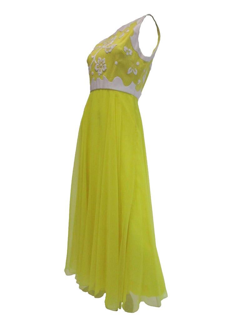 Impeccable sunshine yellow dress by Harmay! This dress is full length with a jewel neckline, a chiffon skirt that beams down from the empire style waist. The top is decorated with french knot embroidery and silk floral applique over textured cotton.