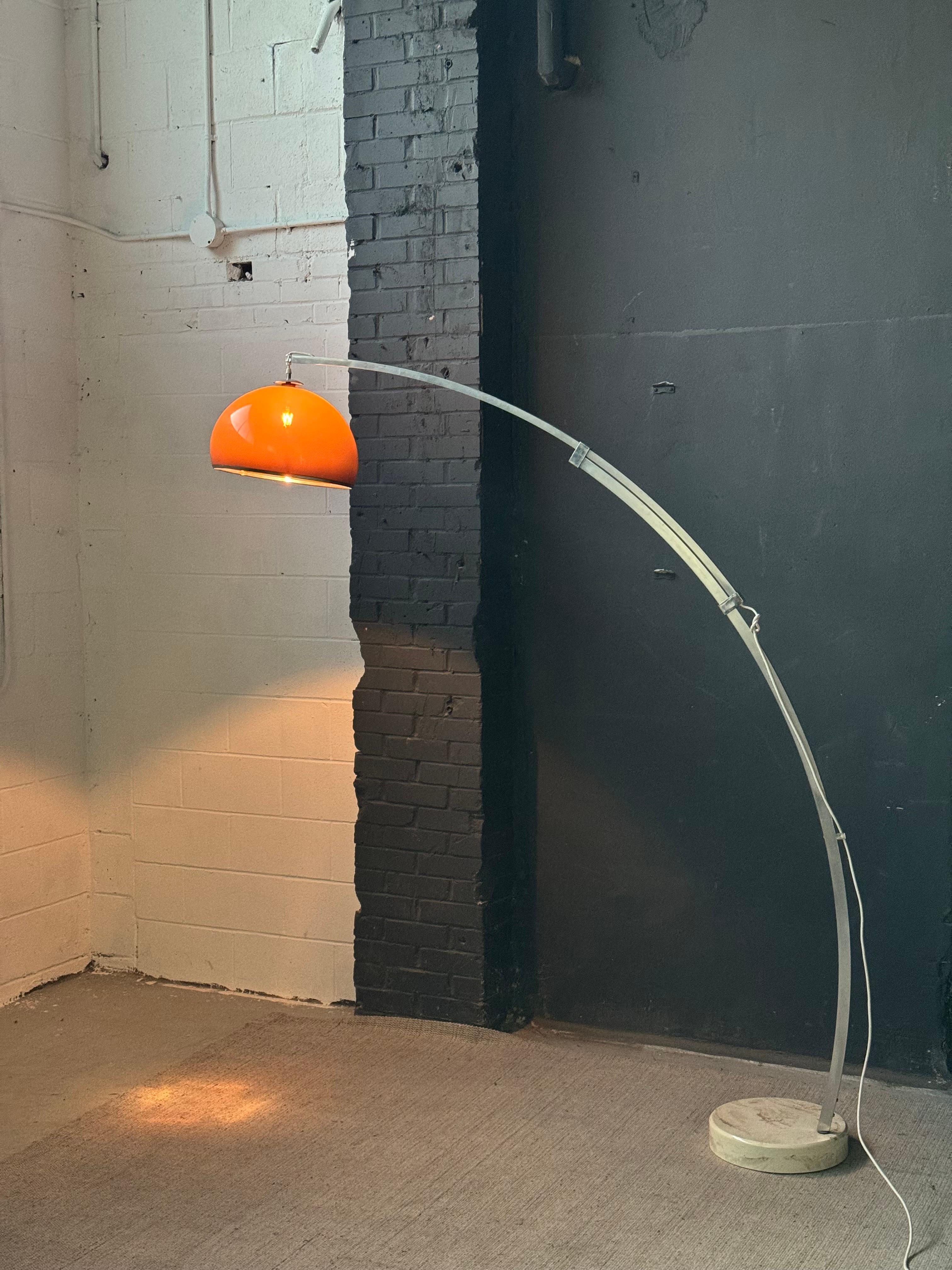 Brilliant vintage extendable arc lamp. Deep brown lucite shade. Beautiful, rich espresso brown hues unveiled once illuminated. 

Multifunctional aluminum shaft, which can extend and retract. Marbled concrete base. 

In good vintage condition, wear