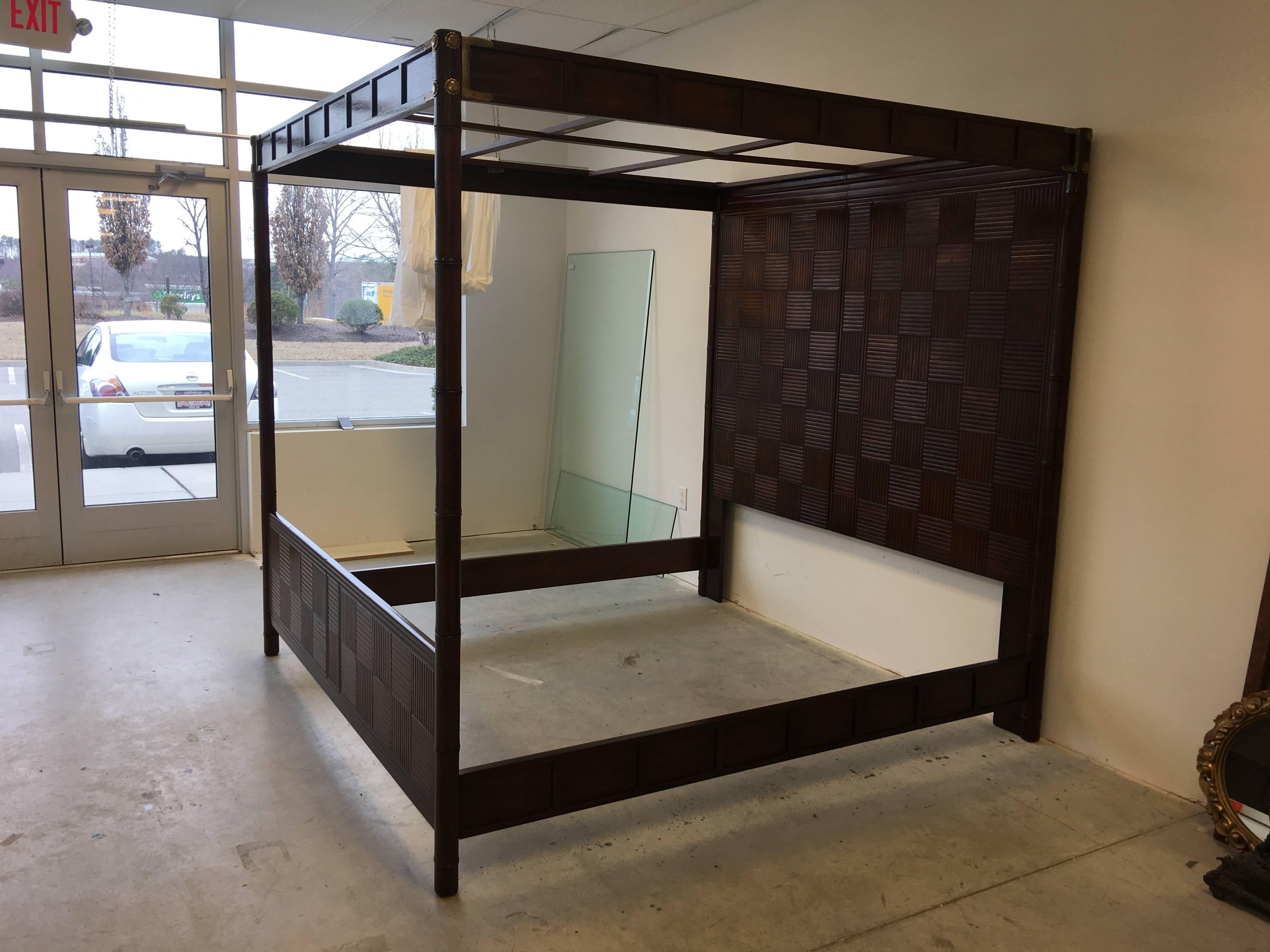 Offered is a stunning, 1970s Henredon Fine Furniture faux bamboo king size canopy bed, with brass Campaign style accents along the headrails. The bed is made for use with a metal bed frame, not included, and does not include or have slats to