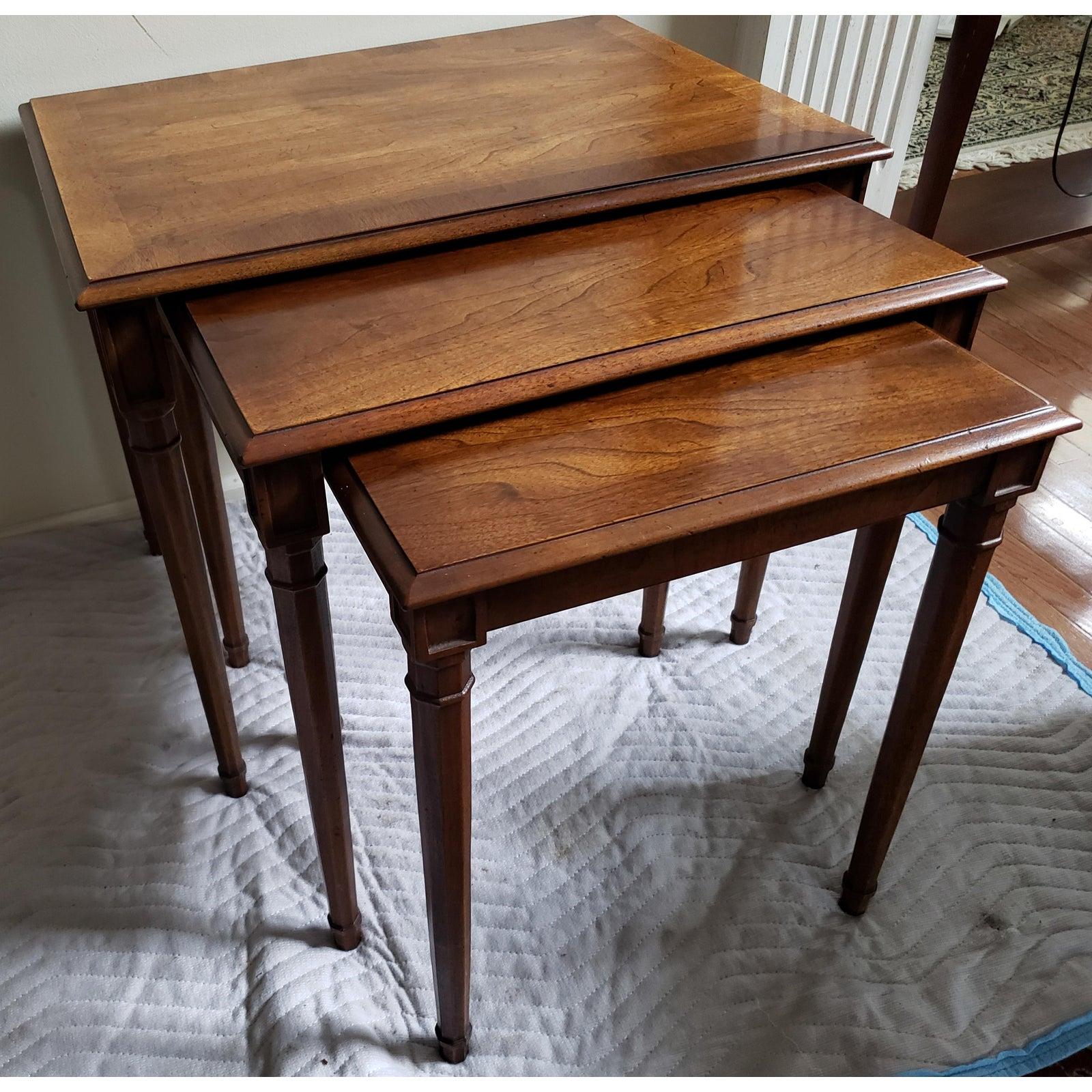 Solid dark Walnut Nesting Tables by Henredon. Manufactured in 1976. Hand Rubbed finish. Excellent condition with minimal wear. Measurements:
Large Table 27.25W x 20.25