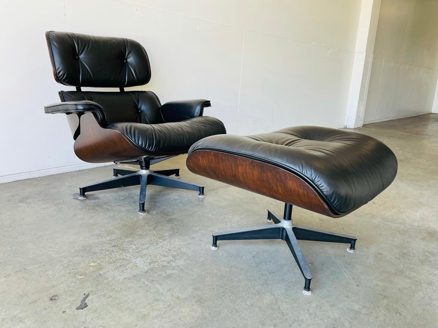 Beautiful Eames chair and ottoman by Herman Miller from the 1970s. Beautiful wood frame with black leather upholstery.

The black leather is in vintage condition and all parts are intact.

The chair swivels and the chair and ottoman both have