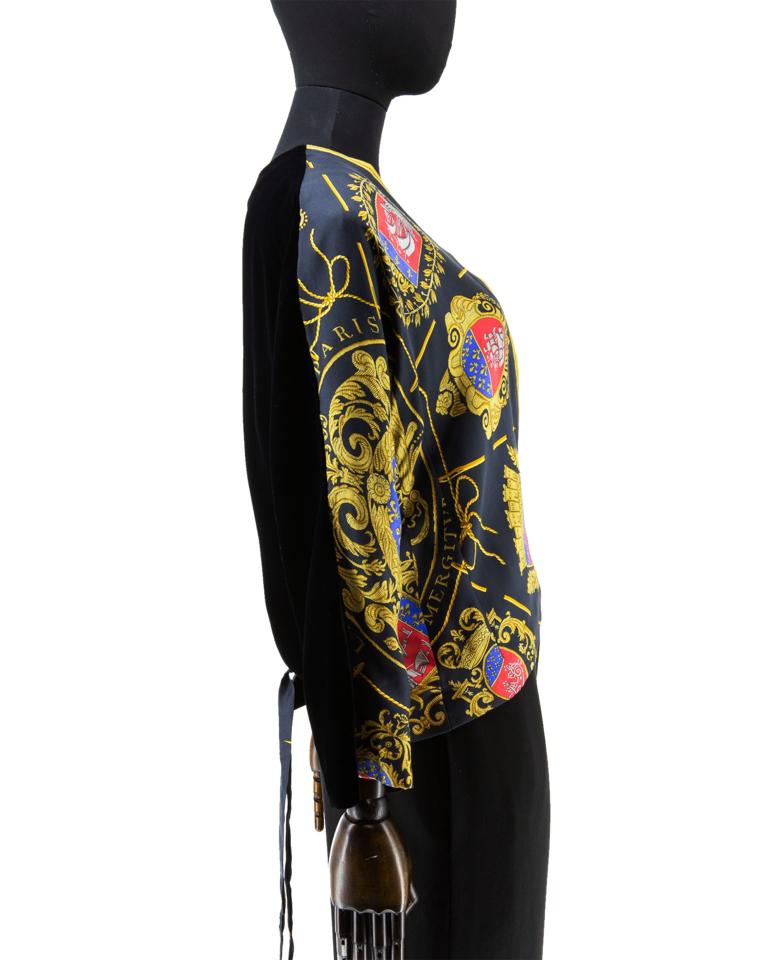 A rare and highly collectible late 1970’s Hermes unstructured wrap-over jacket with deep V-neckline and stylized kimono sleeves, the front of fine silk twill woven panels with an all-over print of Hugo Grygkar’s design (first issued in 1954)