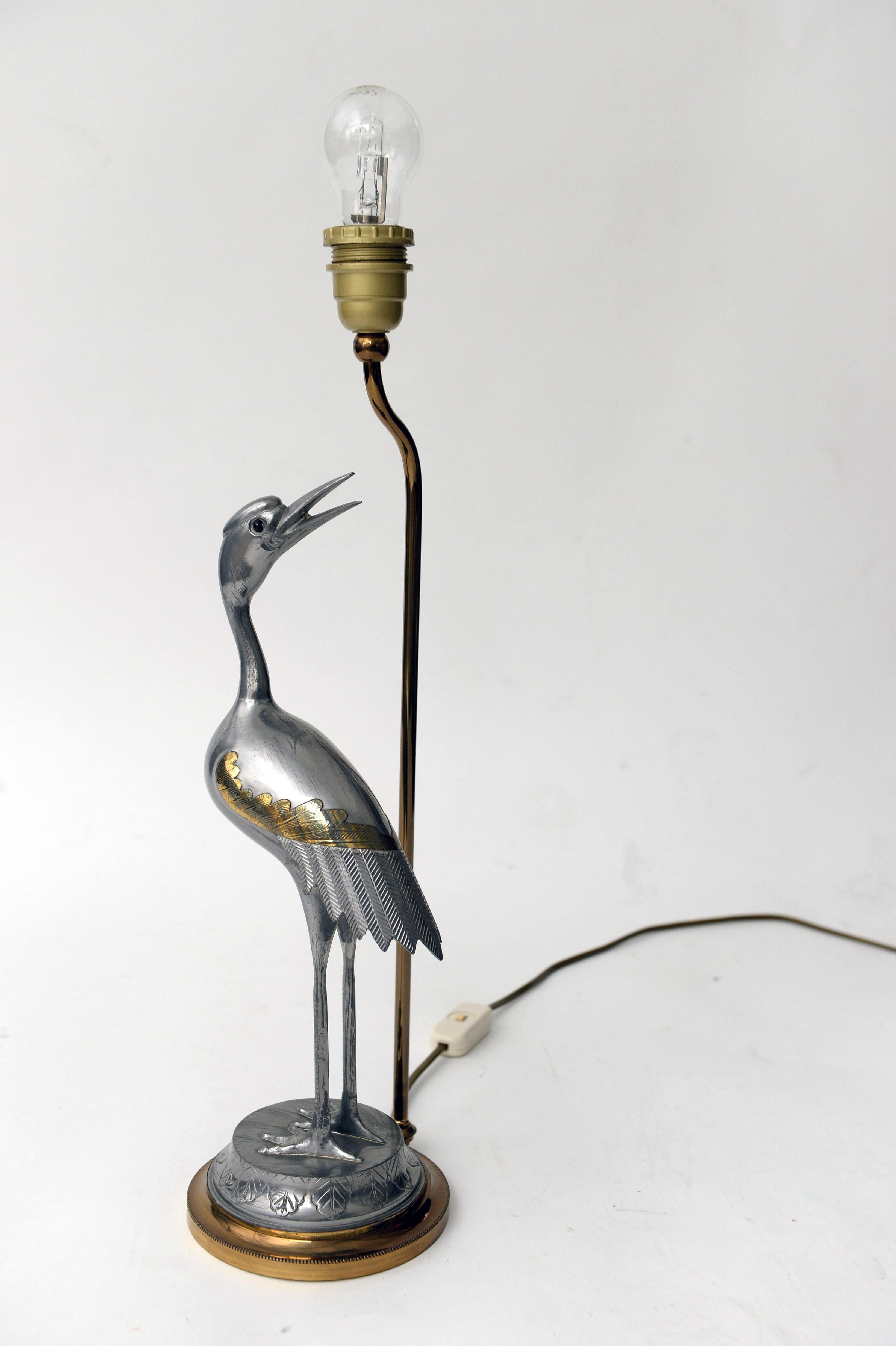 Vintage Table Lamp, Table Light with Heron Bird.
Stylish 1970s Heron Bird or Crane bird Table Lighting in Brass and Metal.
In the style of Sergio Bustamante.

With original beige shade; gold color inside with old retouched Spots  ( see pics ! ).