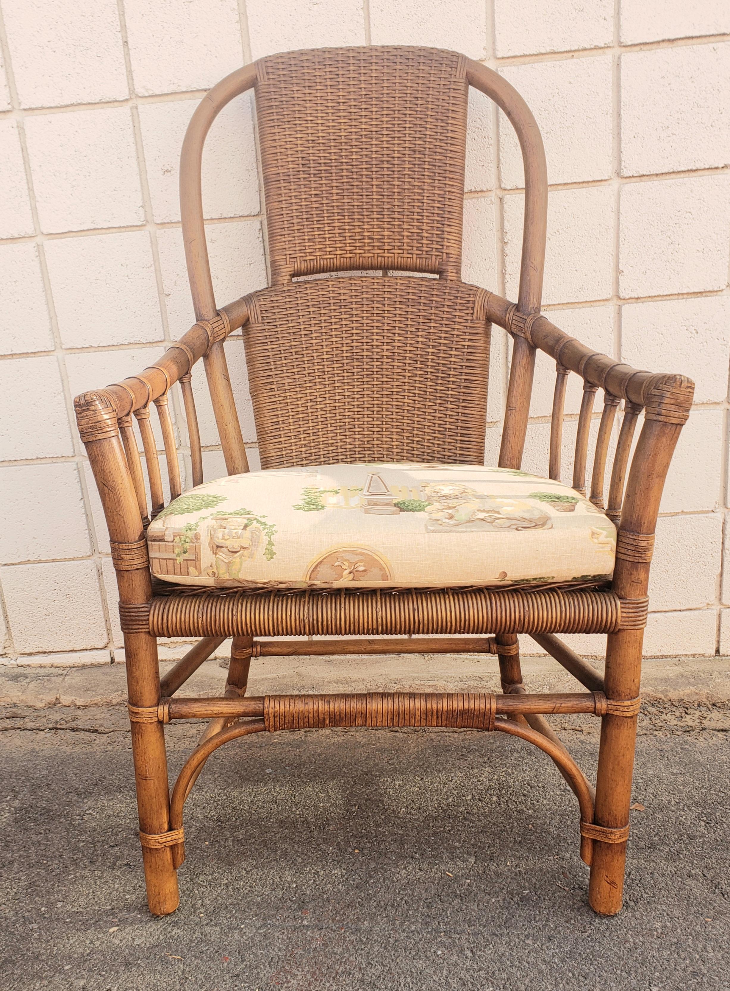A pair of 1970s Ficks Reed High Hoop Back Rattan and Leather Straps Arm Chairs with great patina and very good condition with strong , double layer wicker backs. The chairs stand 45.5