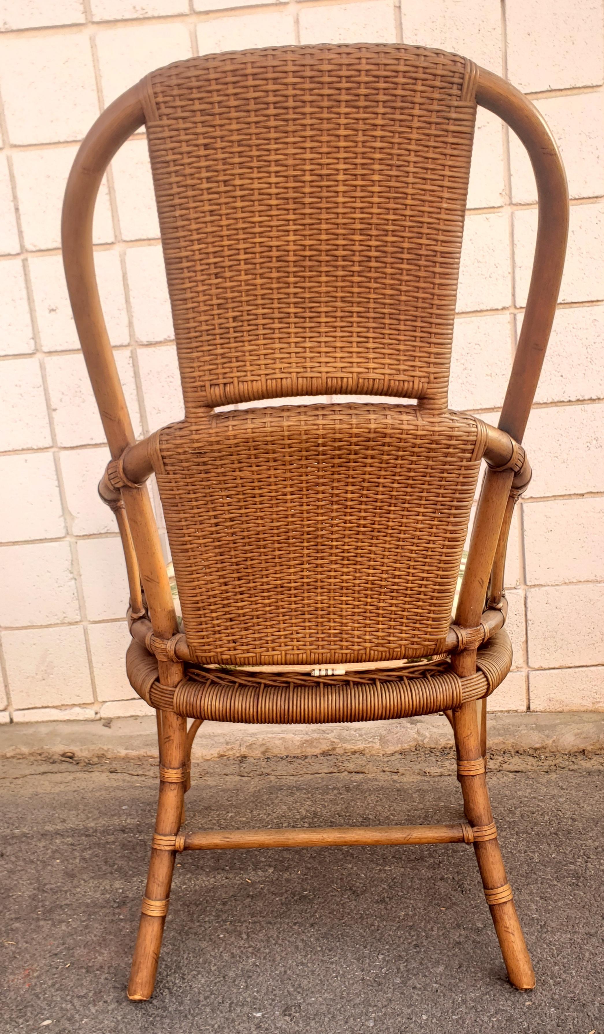 20th Century 1970s High Hoop Back Rattan and Leather Straps Arm Chairs, a Pair For Sale
