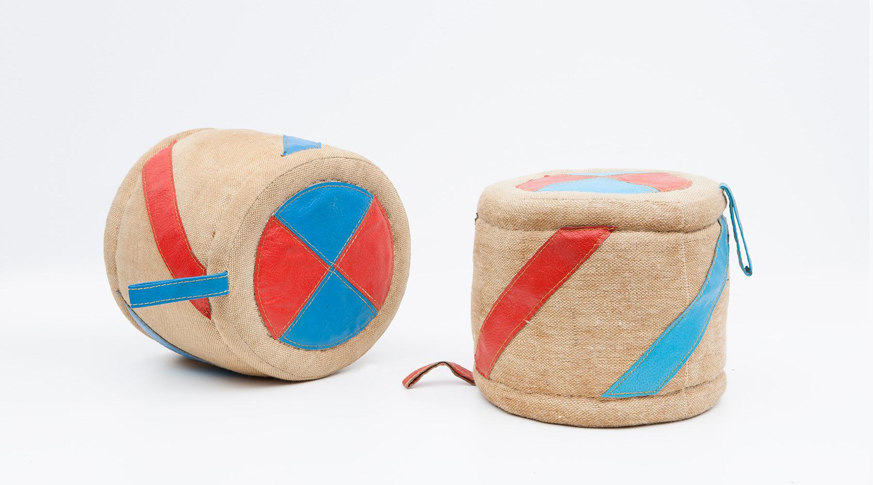 Two rolls, children toy in jute and leather by Renate Müller, Germany, 1972.

Authentic children toy from the 1970s by Renate Müller. Unique in shape and workmanship. This example shows two rolls in a shape of drums and made of jute and leather