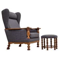 1970s, highback Danish armchair with footstool, furniture wool, solid oak.